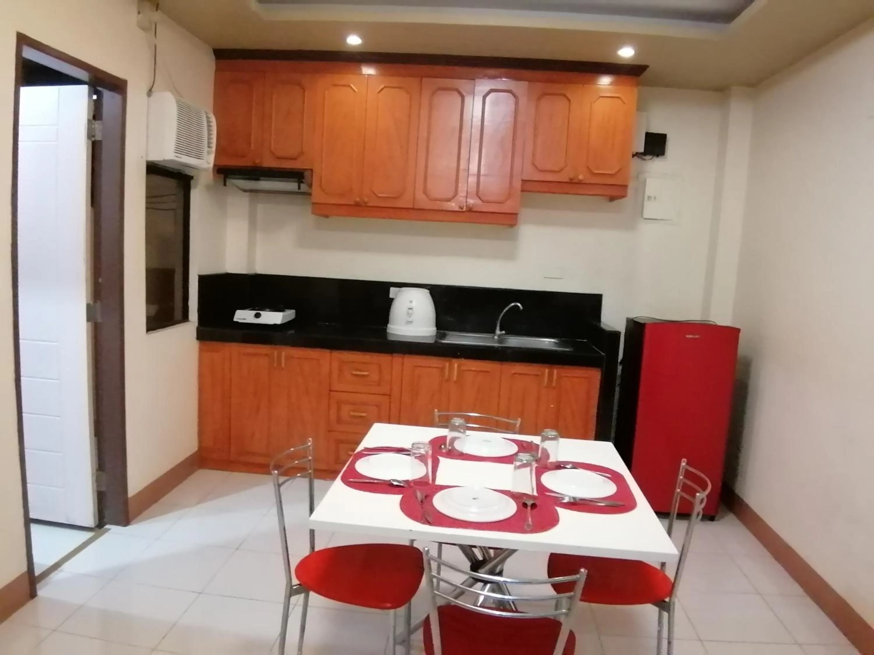 Kitchen or kitchenette in Manora Apartment