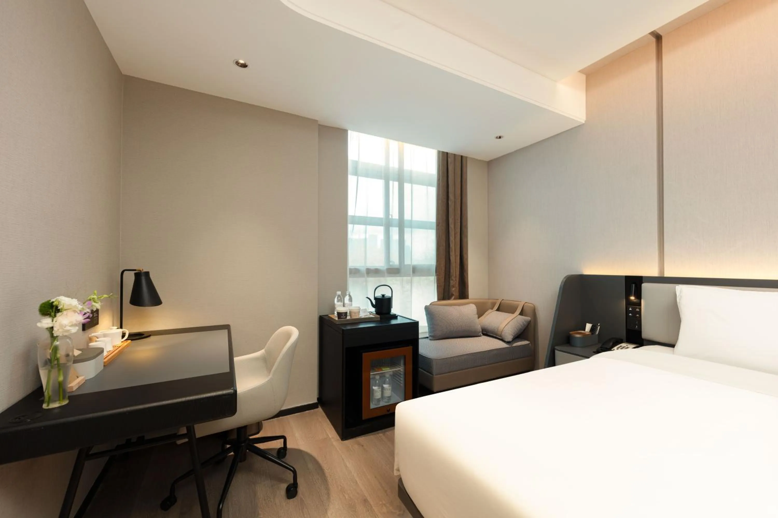 Bed in Atour Hotel Hangzhou Binjiang Olympic Sports