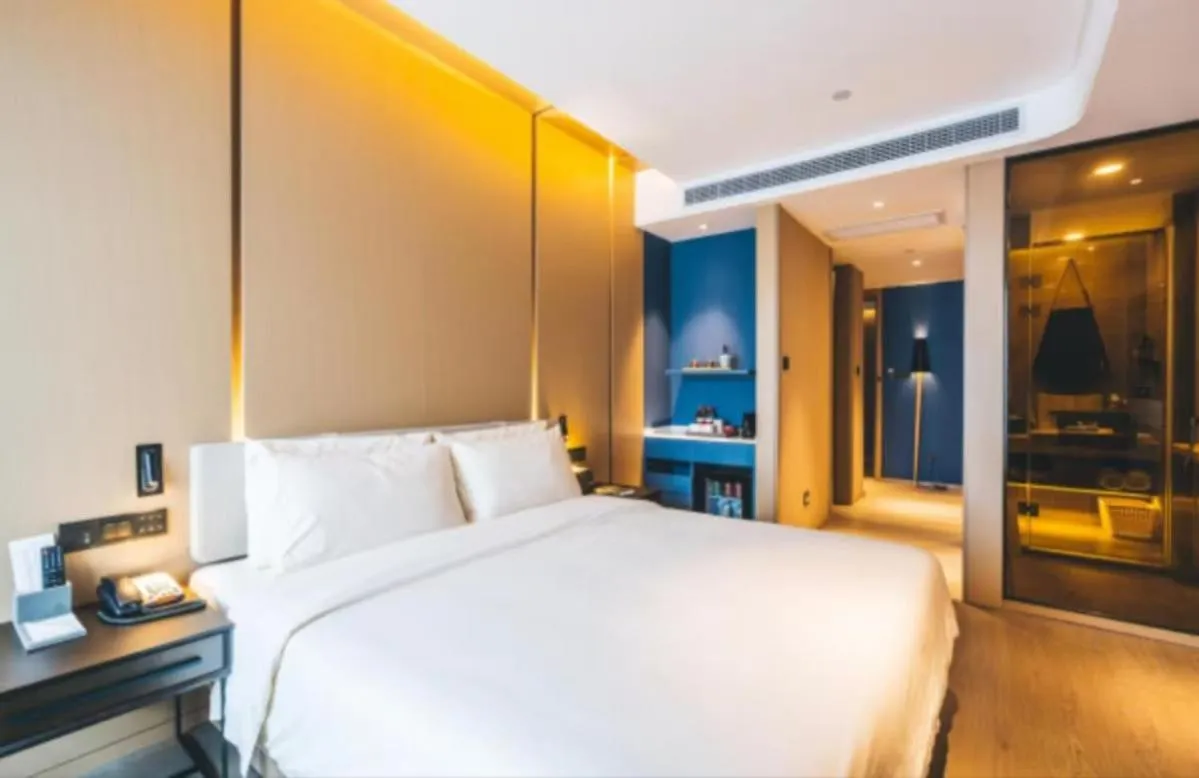 Bed in Atour Hotel Hangzhou Binjiang Olympic Sports