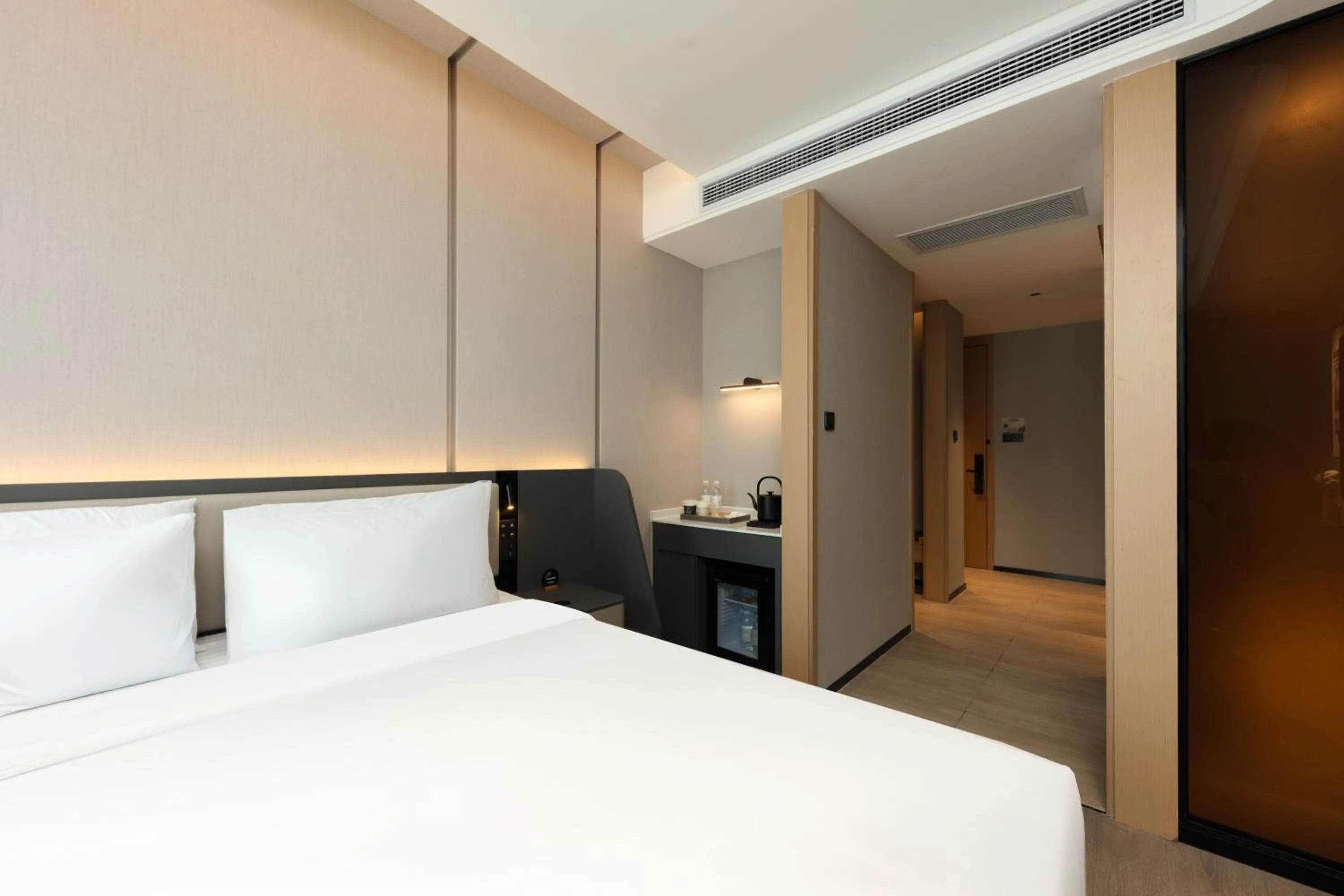 Bed in Atour Hotel Hangzhou Binjiang Olympic Sports