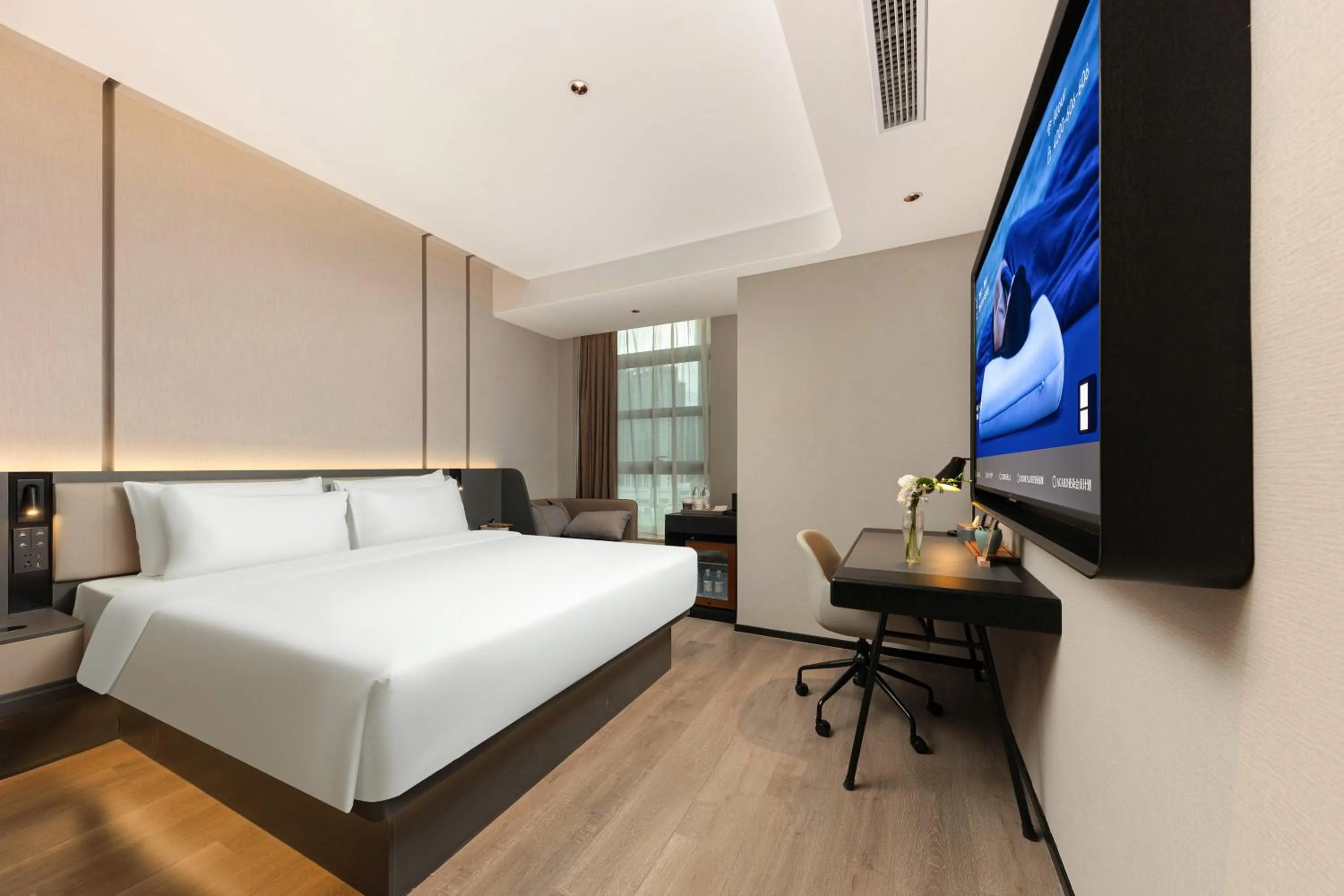 Communal lounge/ TV room, Bed in Atour Hotel Hangzhou Binjiang Olympic Sports