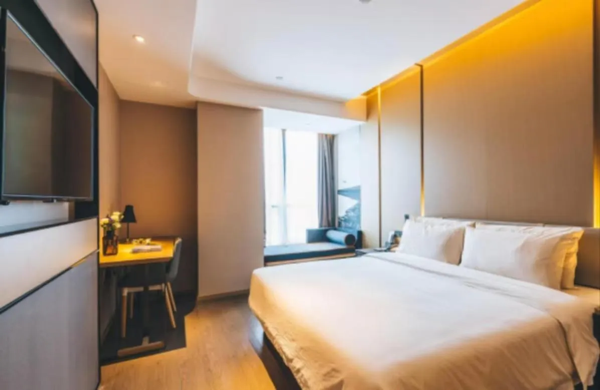 Bed in Atour Hotel Hangzhou Binjiang Olympic Sports
