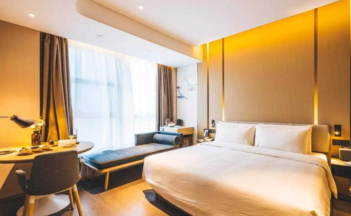 Bed in Atour Hotel Hangzhou Binjiang Olympic Sports