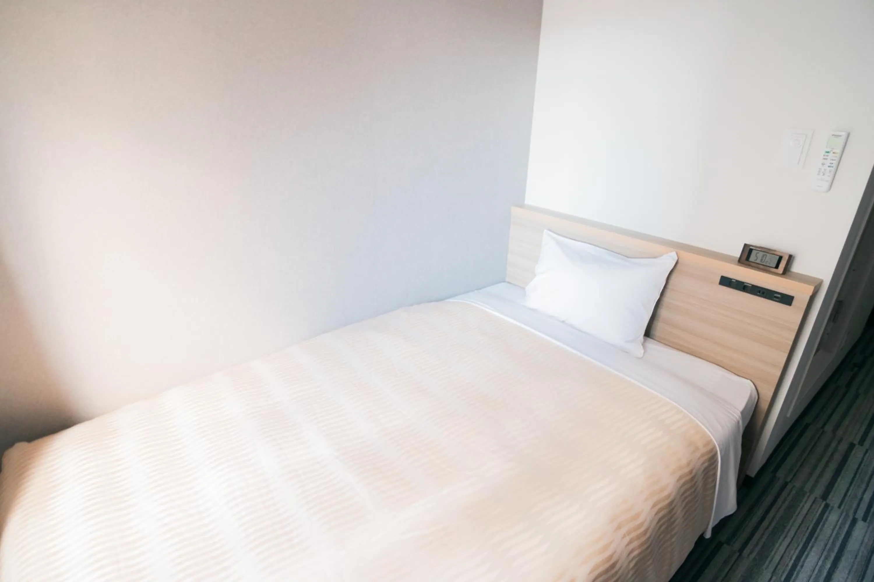 Bed in Quintessa Hotel Chiba Funabashi