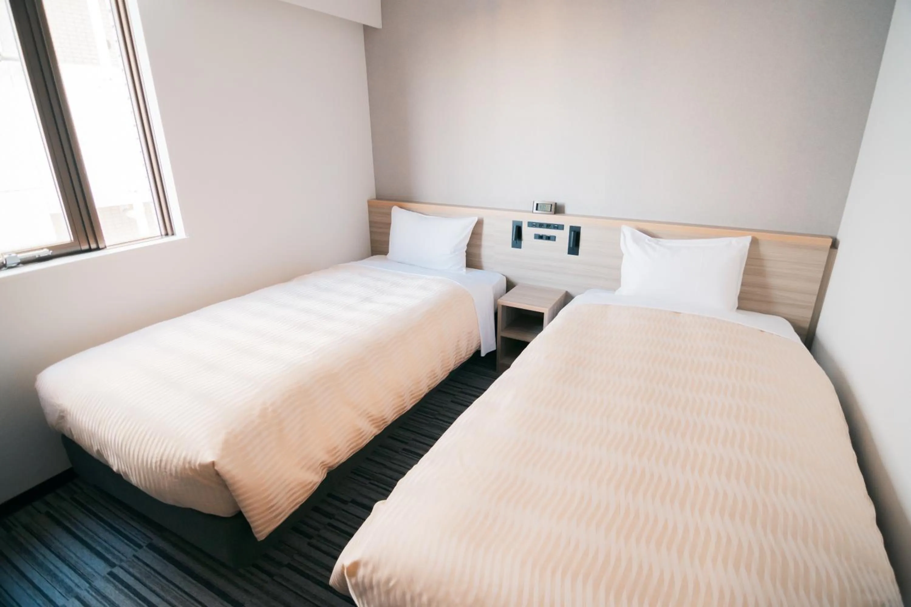 Bed in Quintessa Hotel Chiba Funabashi