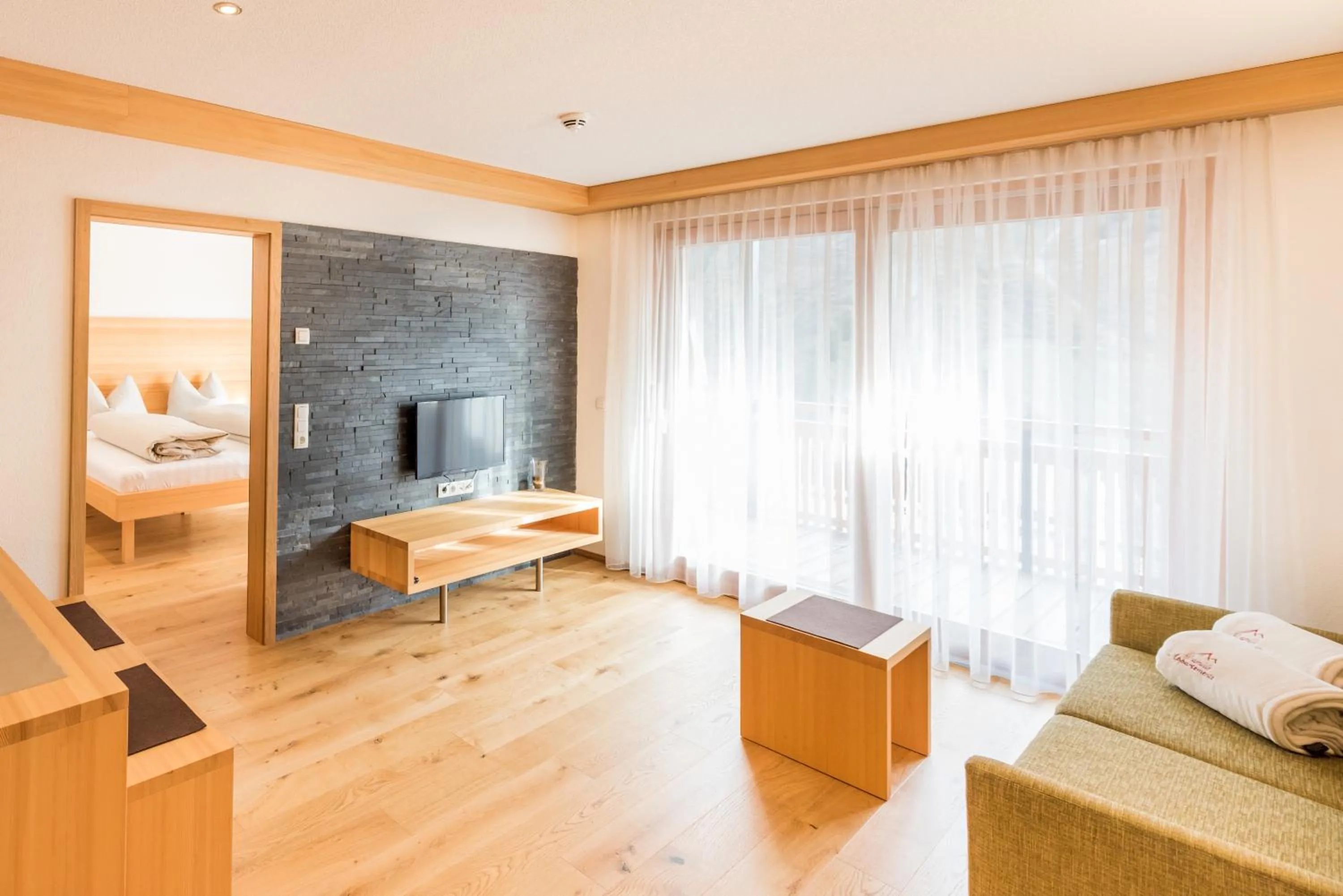 Living room, Bed in Damüls Appartements