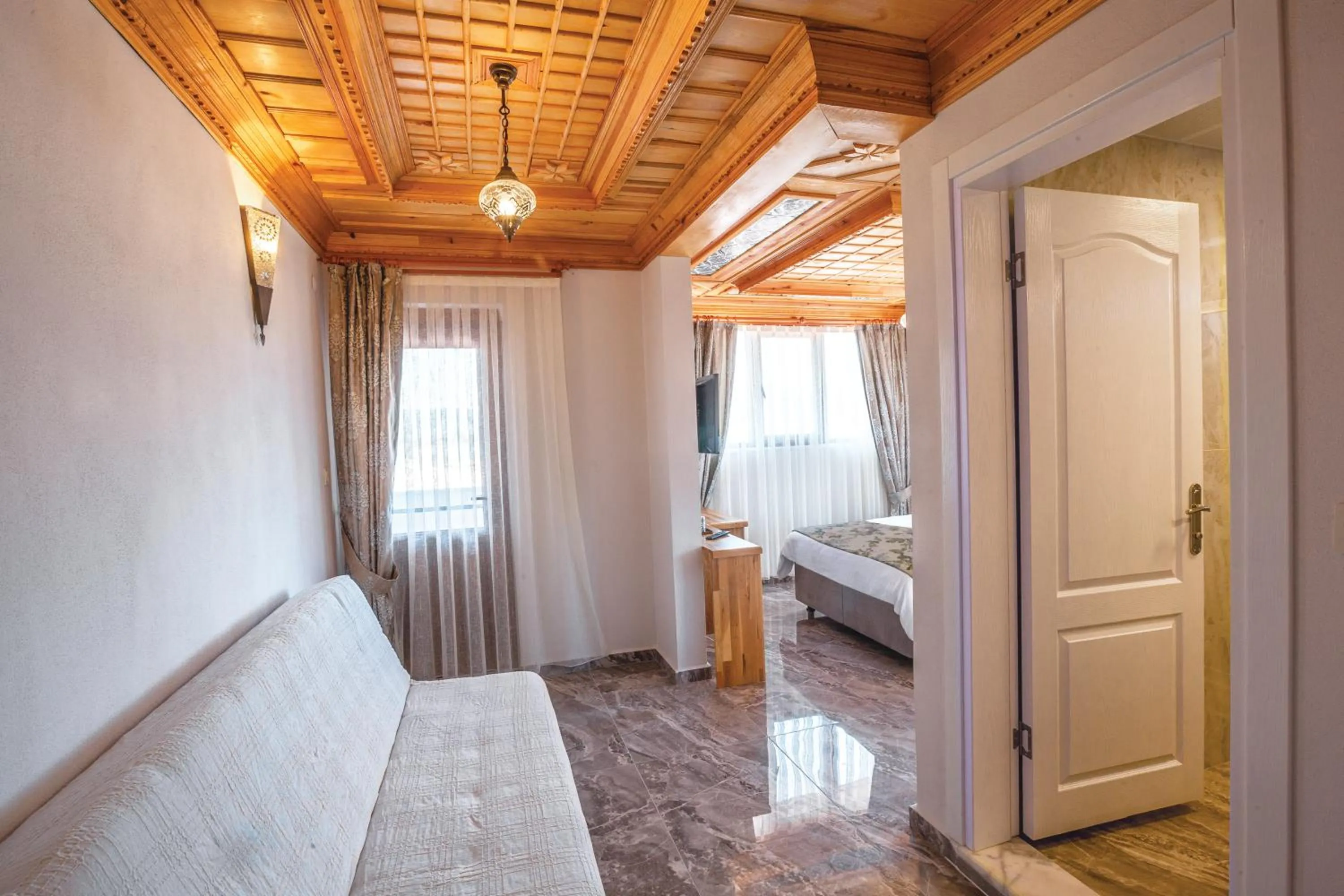 Seating area, Bed in Gumus Konak