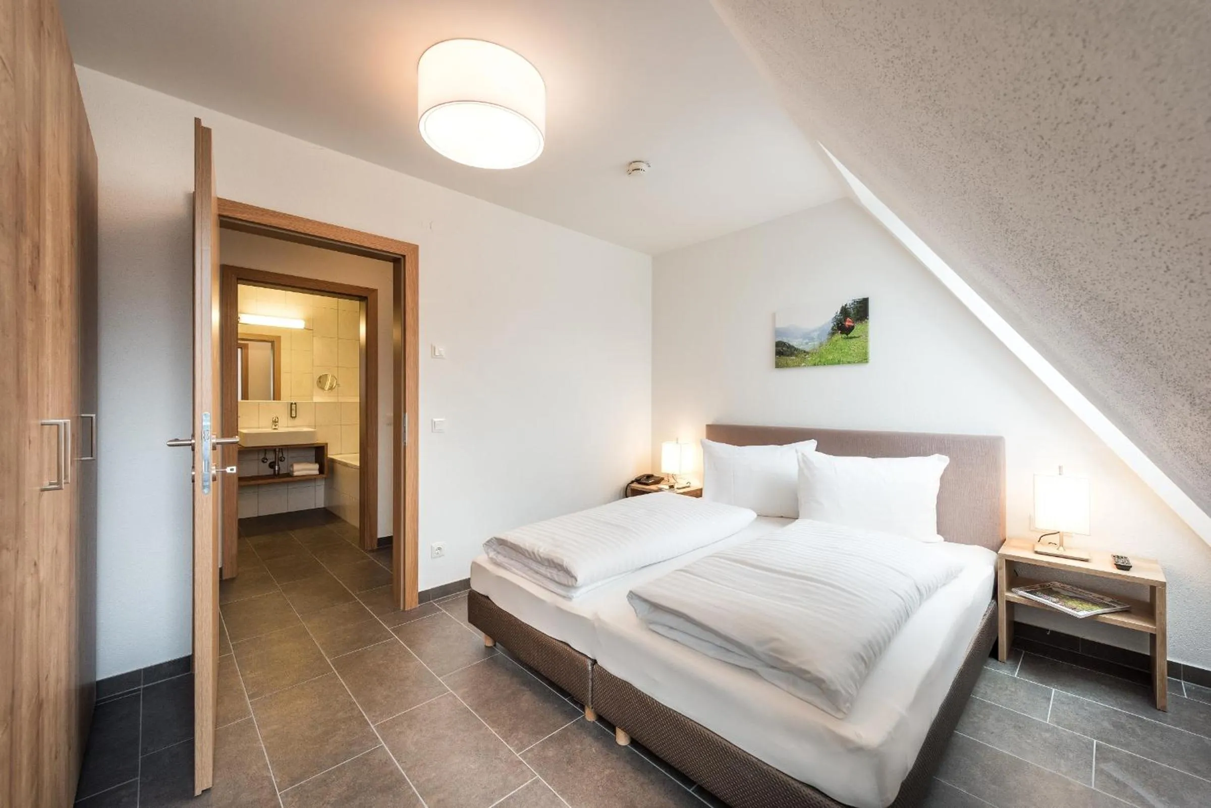 Bedroom, Bed in AlpenParks Hotel & Apartment Central Zell am See