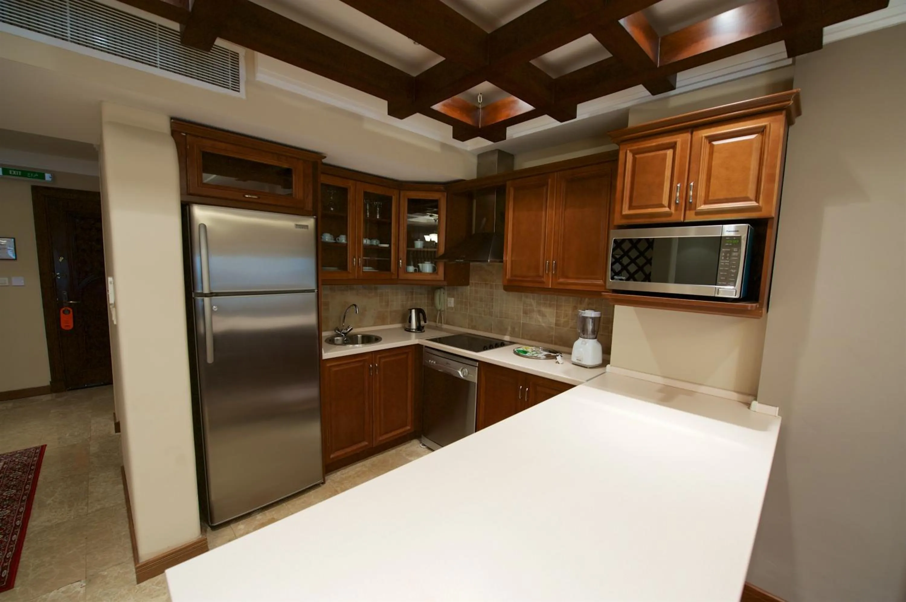 Kitchen or kitchenette in Rawasi Hotel Apartments