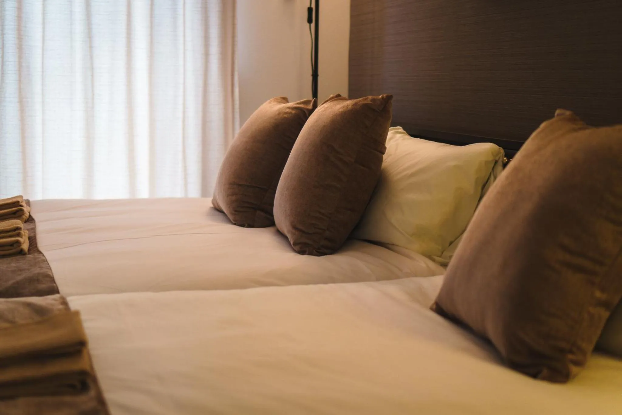 Bed in KINTARO Hotel Okinawa Naha