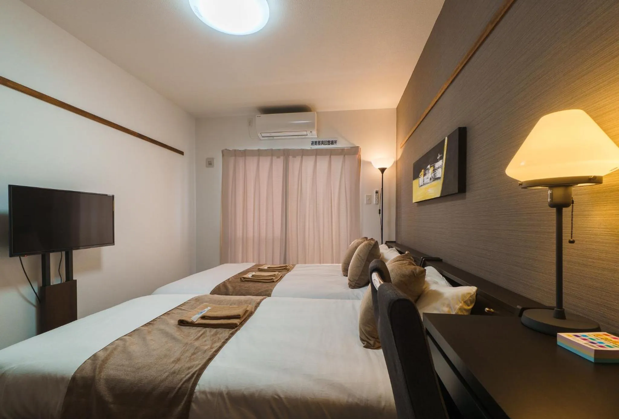 Bed in KINTARO Hotel Okinawa Naha