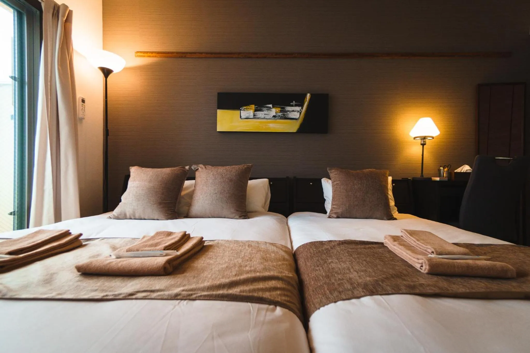 Bed in KINTARO Hotel Okinawa Naha