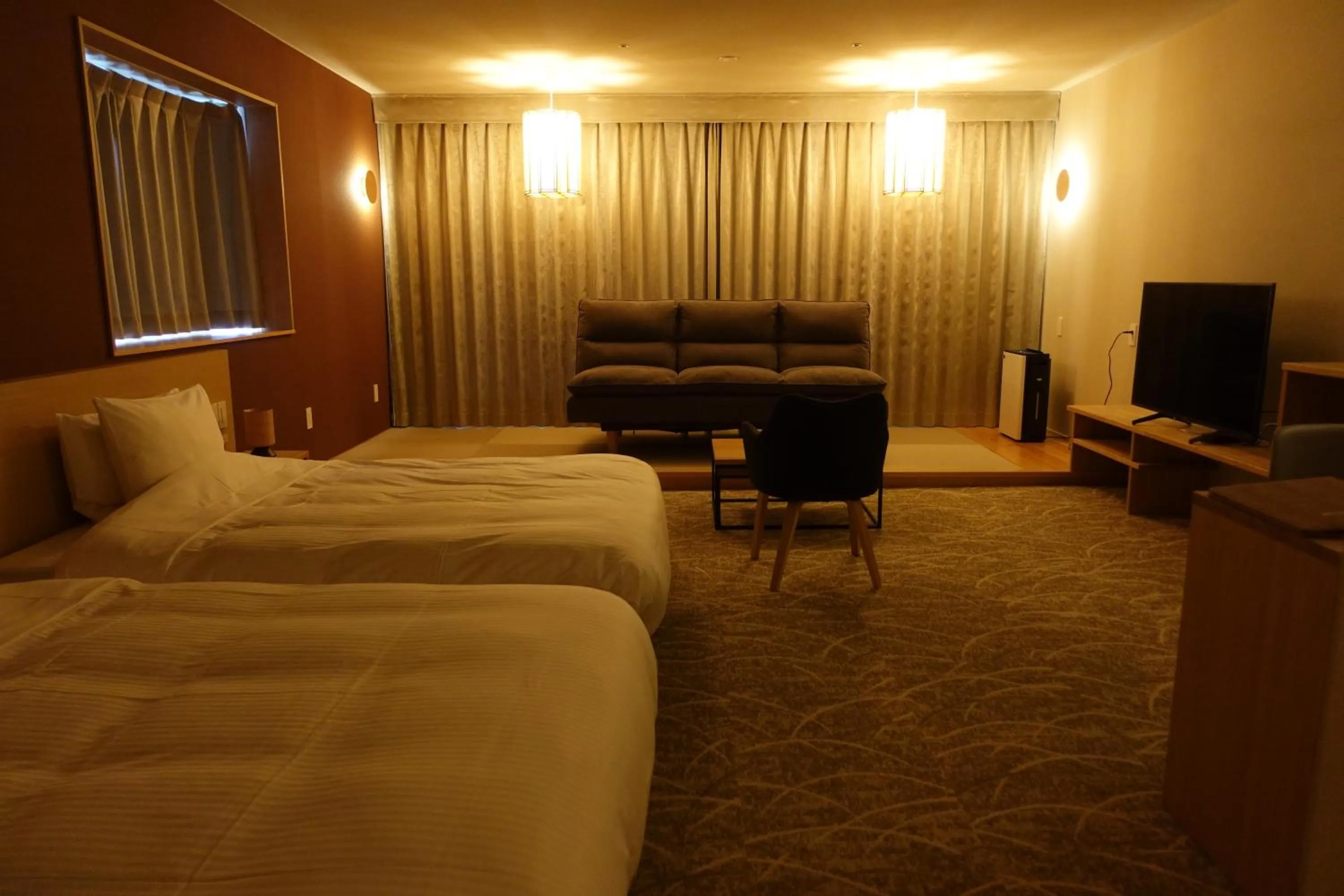 Communal lounge/ TV room, Bed in Resort Hotel RAKI House Nasu