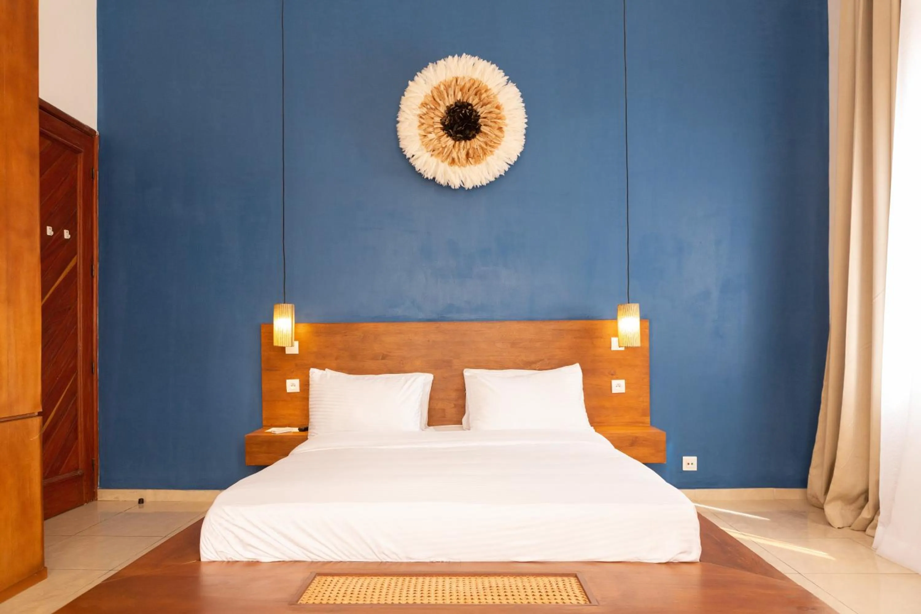 Bed in Tamarin Hôtel Cotonou