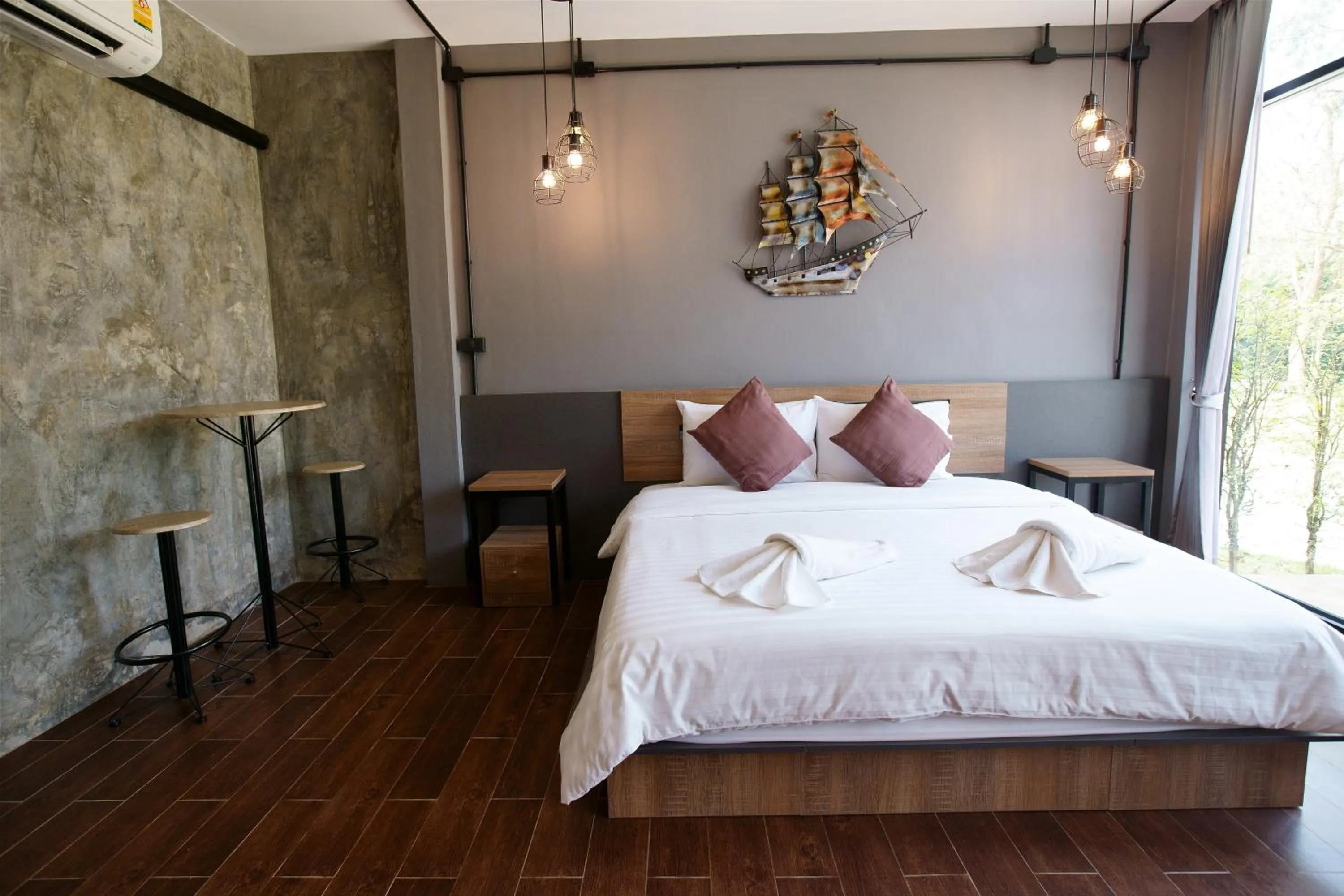 Bed in Kwai Tara Riverside Villas