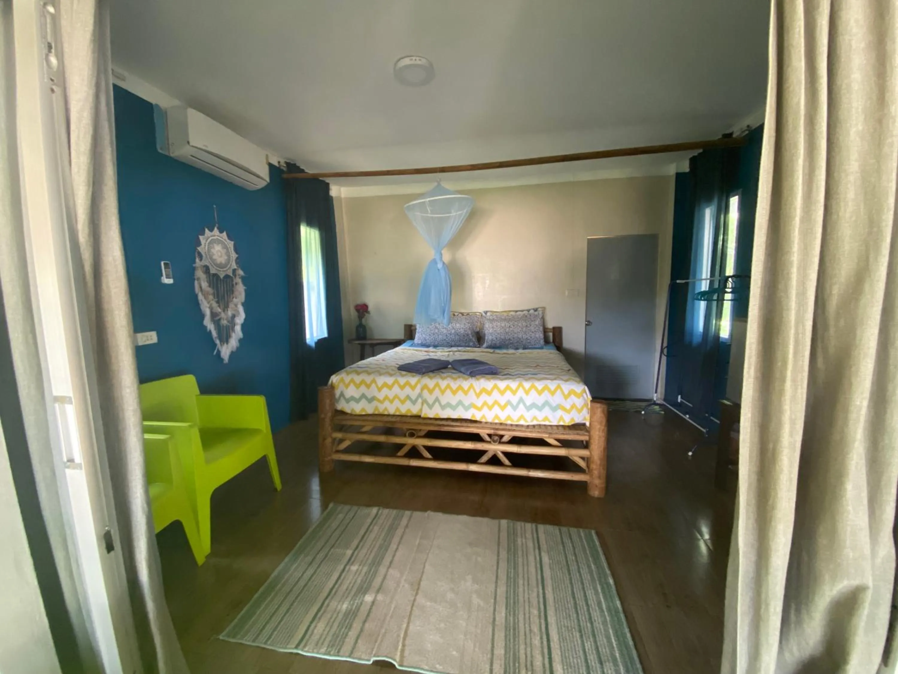 Photo of the whole room, Bed in Secret Beach Bungalows