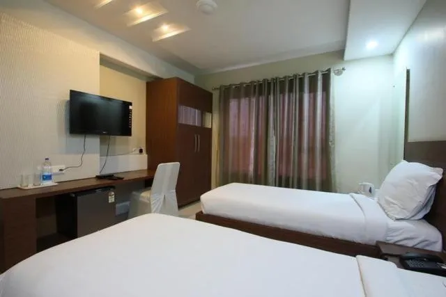 Bedroom, Bed in Hotel Sheela Shree Plaza