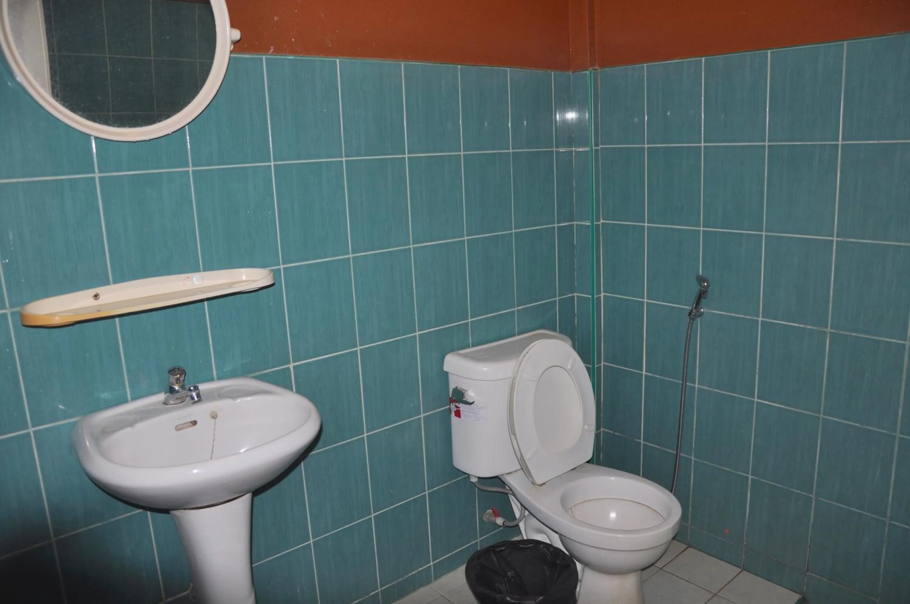 Toilet in Coral Bungalows