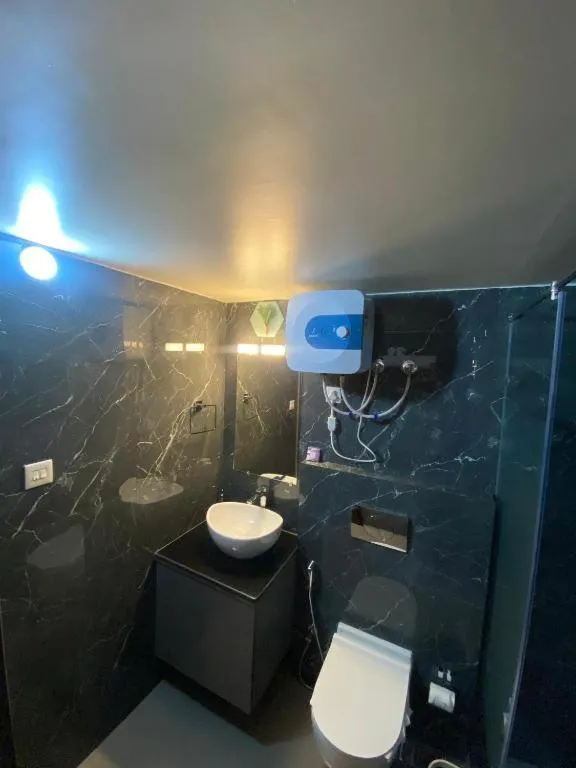 Toilet in XCELSIOR HOTEL & SPA