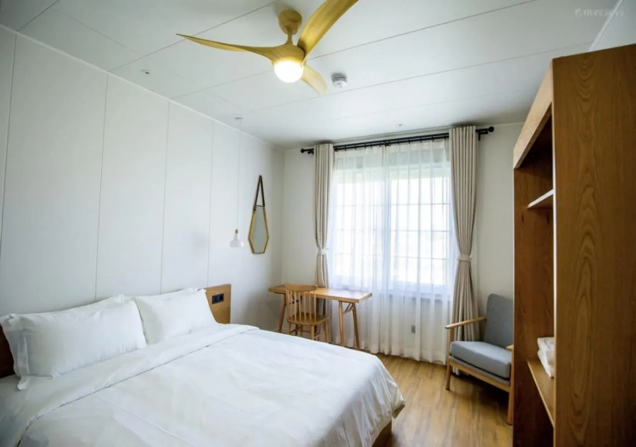 Bedroom, Bed in Discovery Saipan Hotel