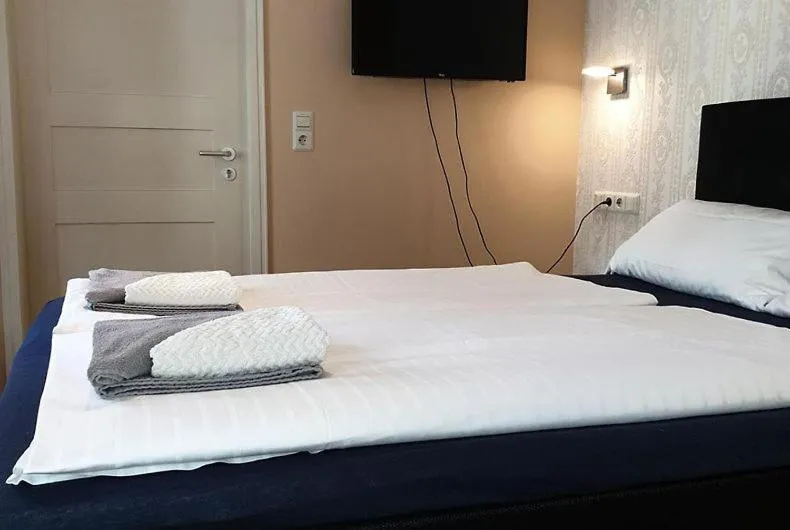 Photo of the whole room, Bed in Gasthof Blauer Bock