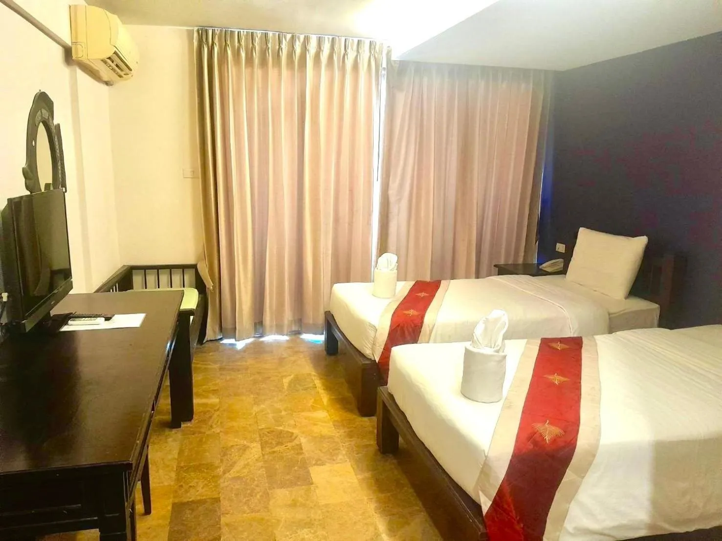 Bed in All Together Suite Hotel