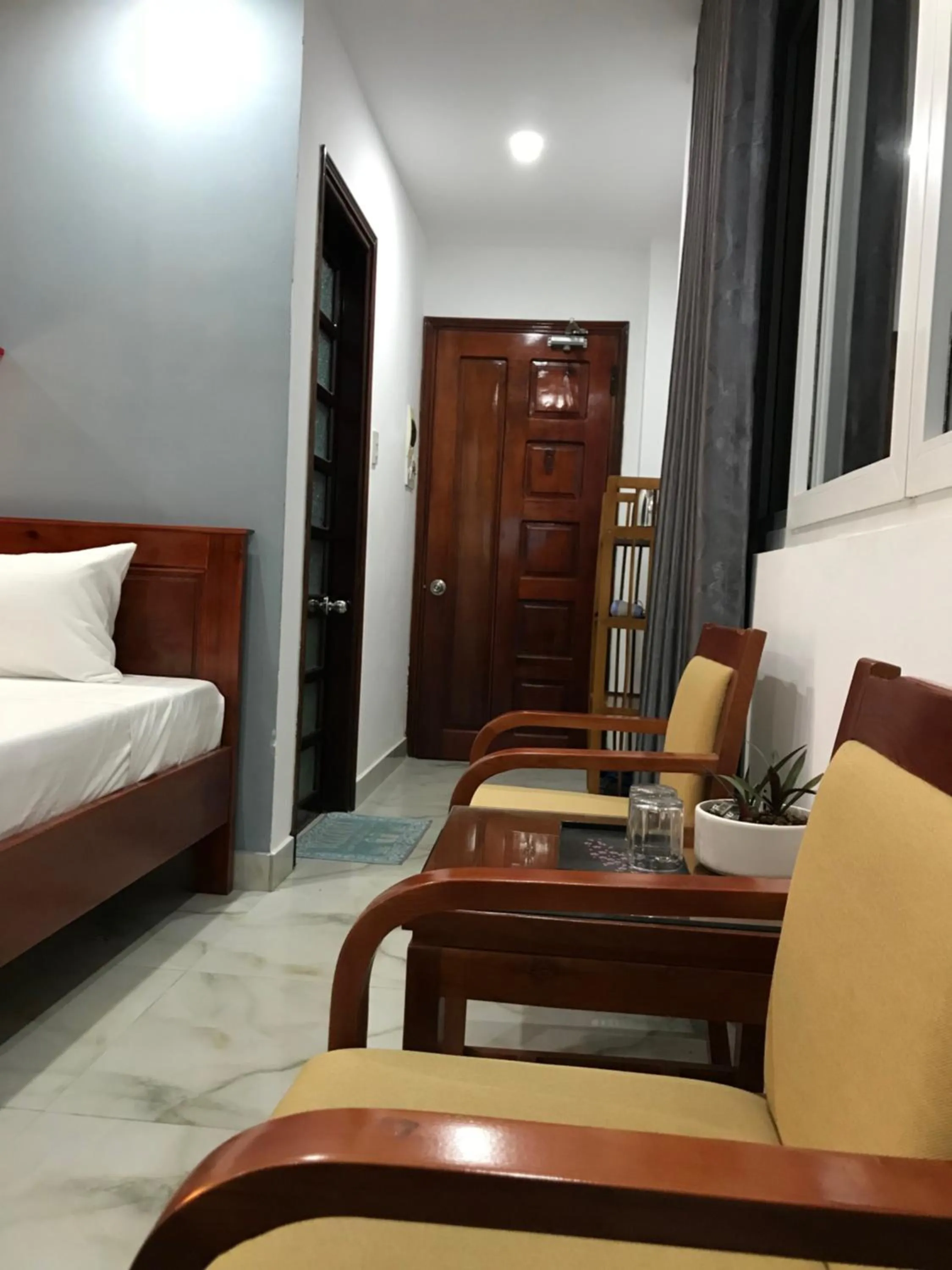 Seating area, Bed in Sunny A Hotel