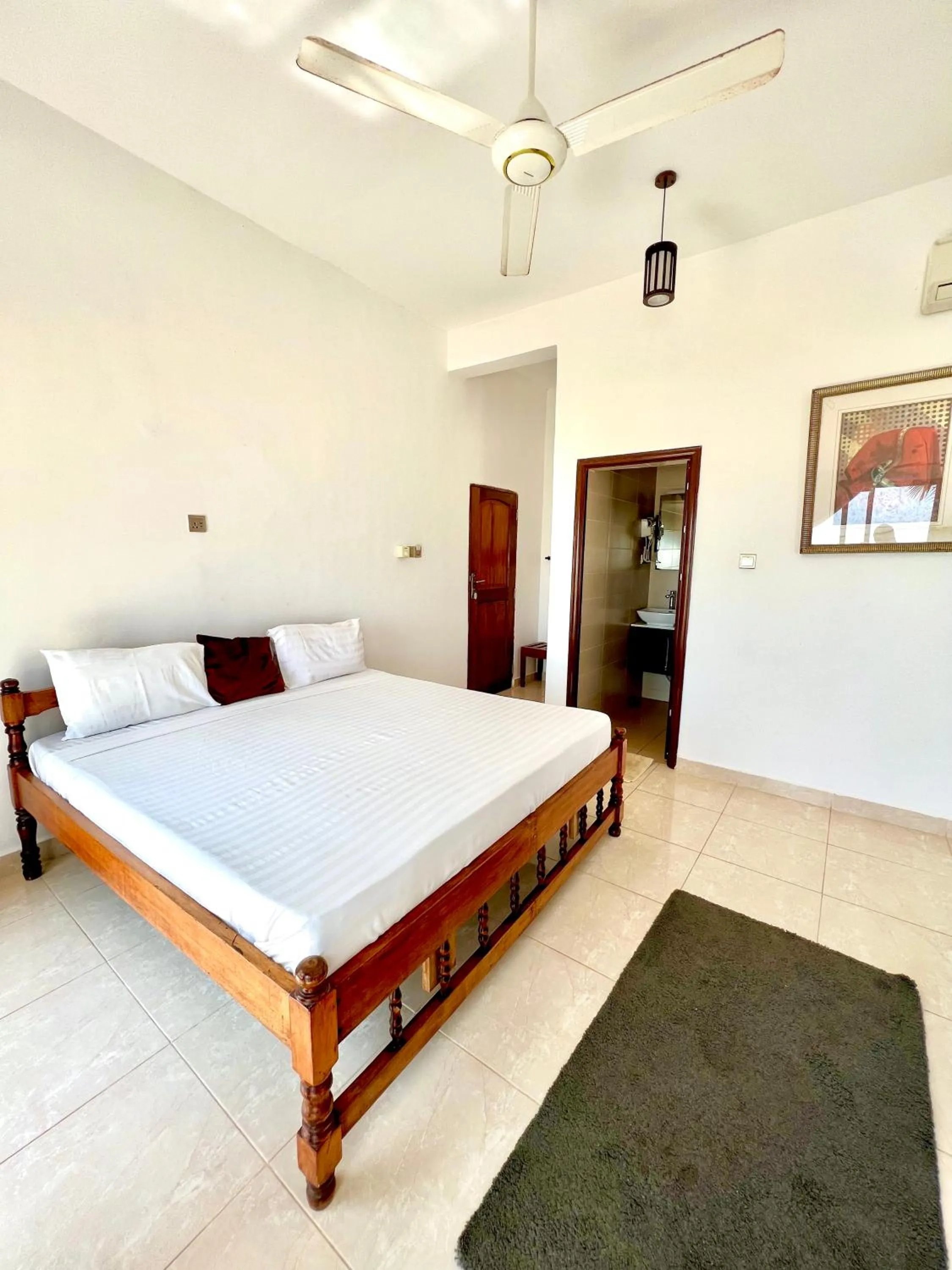 Bed in Jambiani White Sands Bungalows