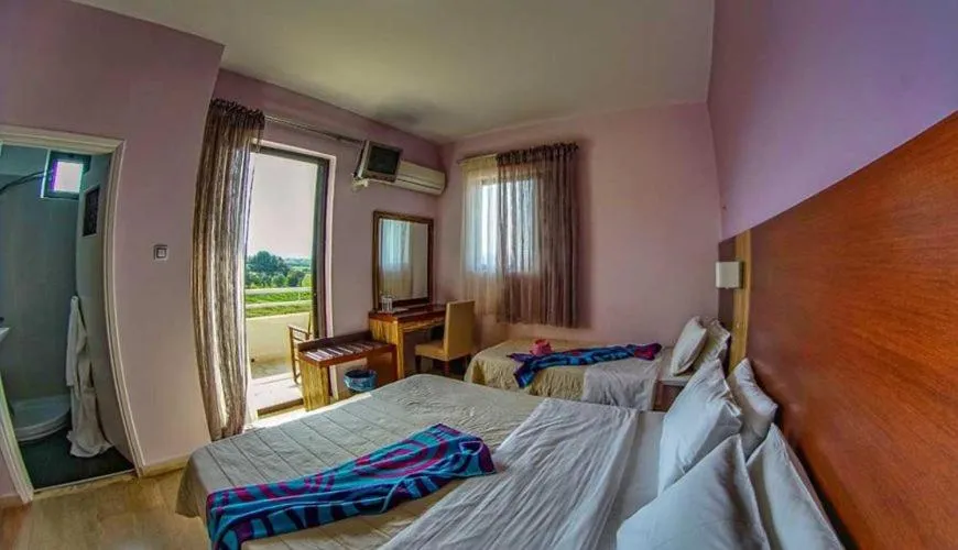 Bed in GOLDEN SUN Κokkoni Beach Hotel