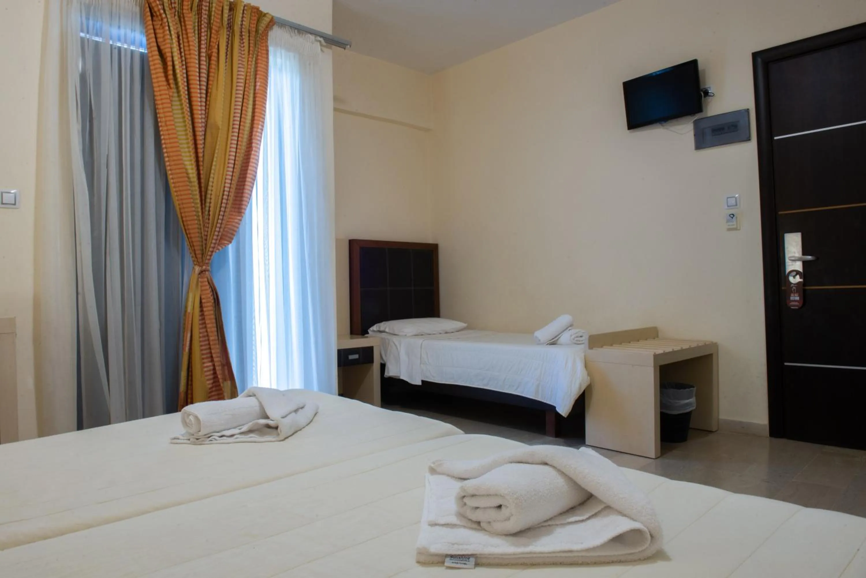 Bed in GOLDEN SUN Κokkoni Beach Hotel