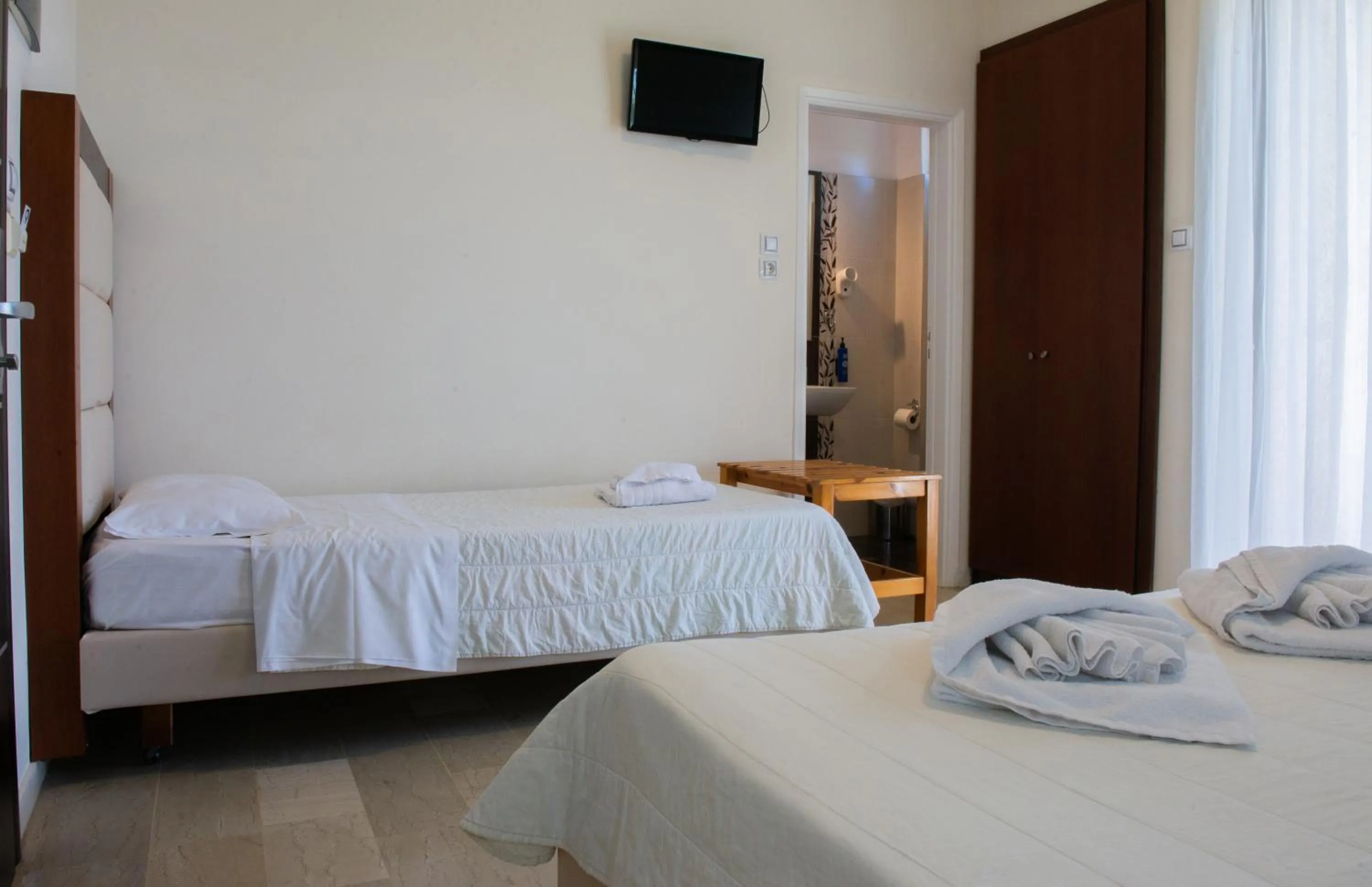 Bed in GOLDEN SUN Κokkoni Beach Hotel