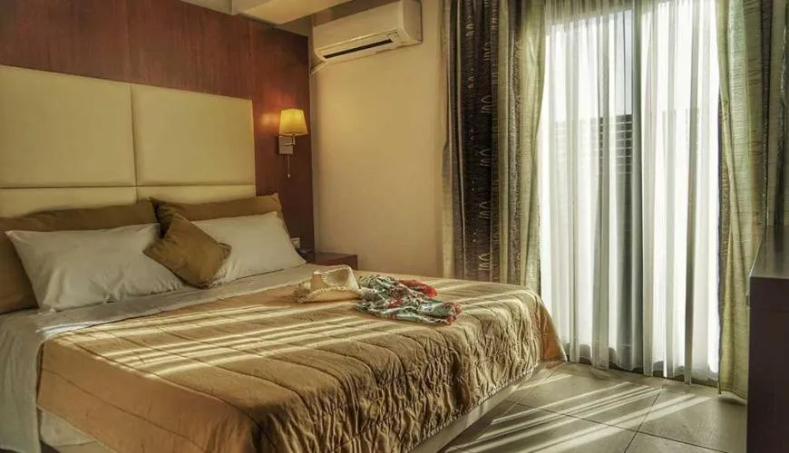 Bed in GOLDEN SUN Κokkoni Beach Hotel