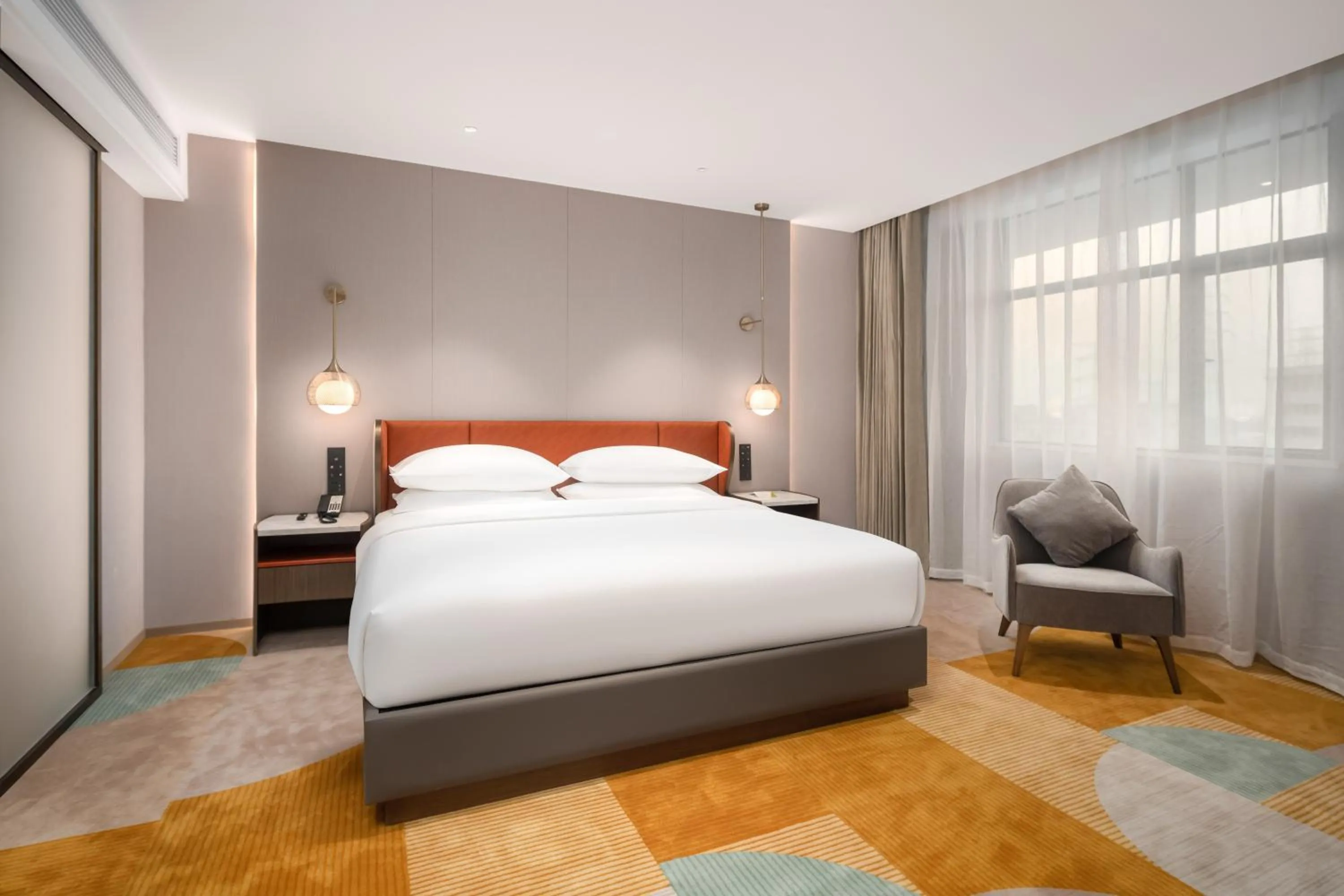 Bed in Home2 Suite by Hilton Dongguan Shijie