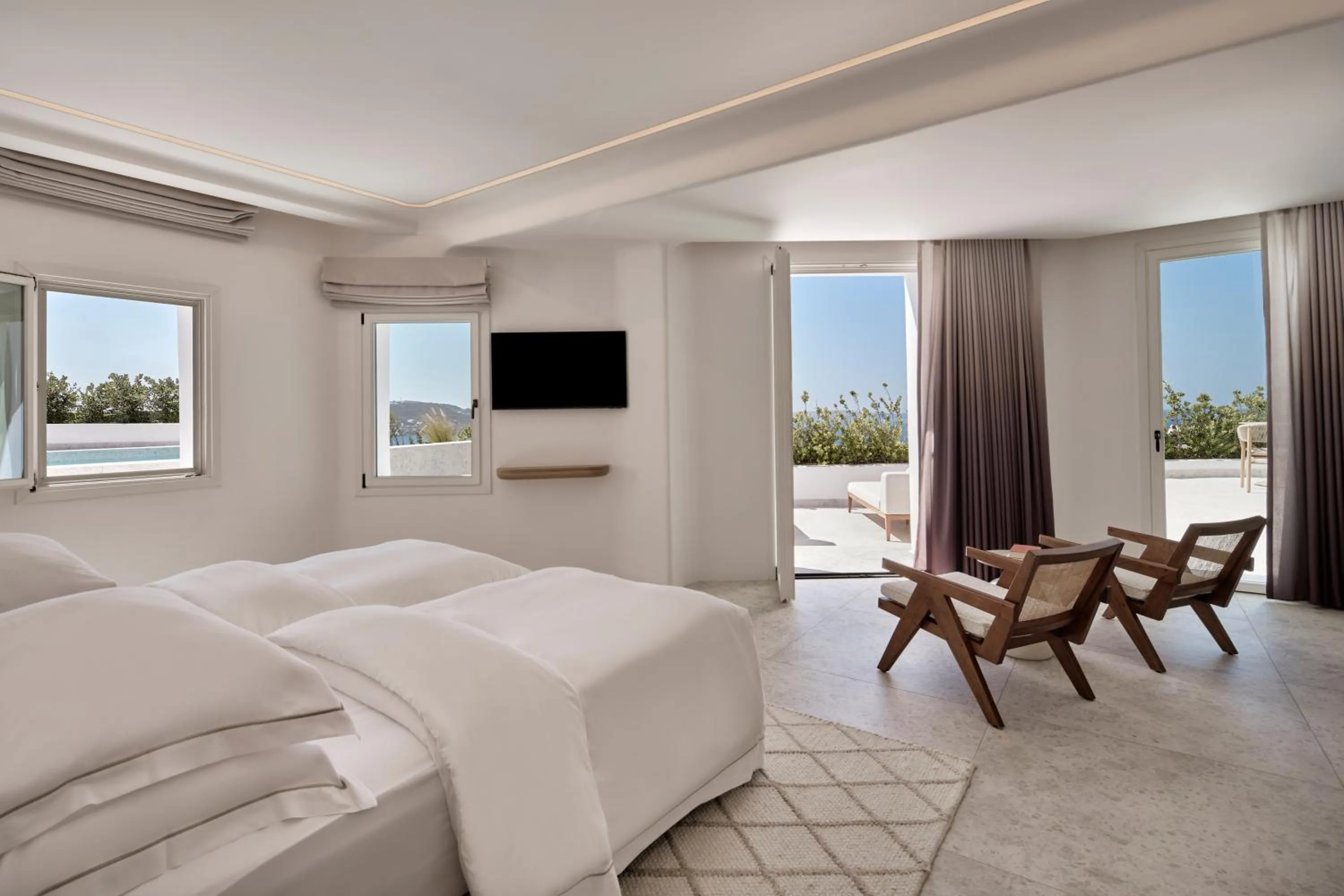 Bed in Deos Mykonos - A Myconian Collection Hotel