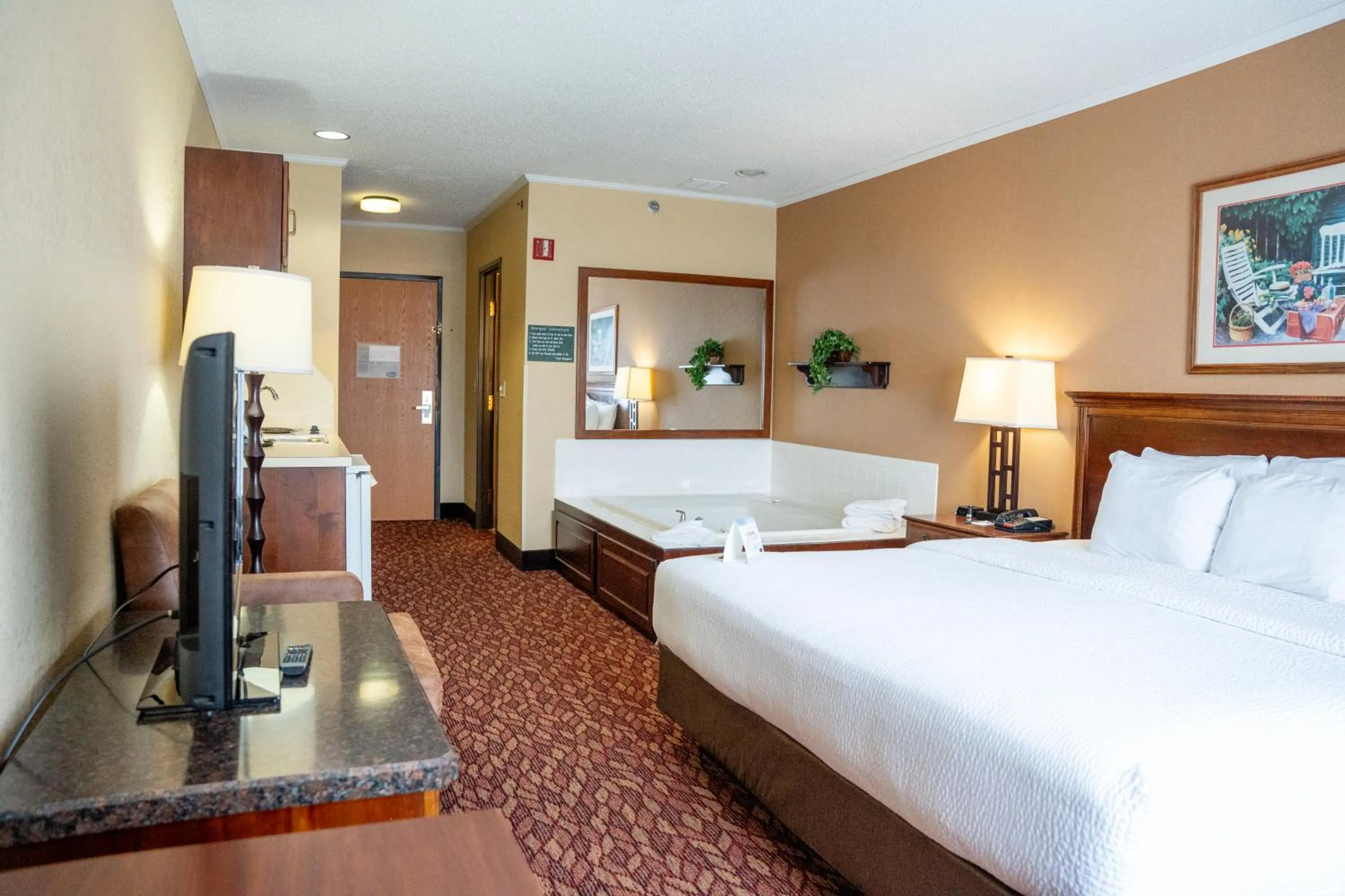 Bed in Coshocton Village Inn & Suites