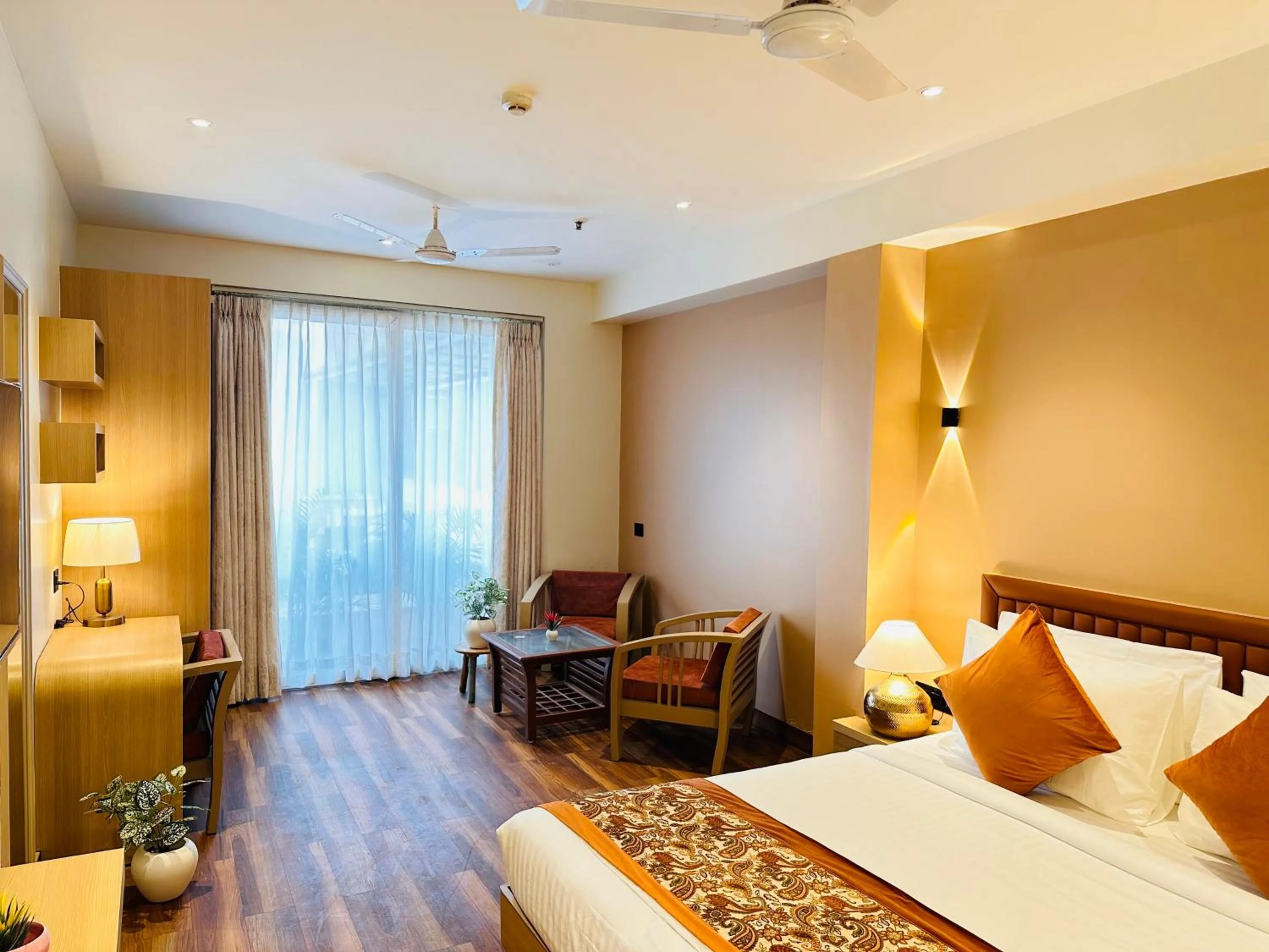 Living room, Bed in Hotel South Ex Residency - South Ex near AIIMS Delhi - Couple Friendly