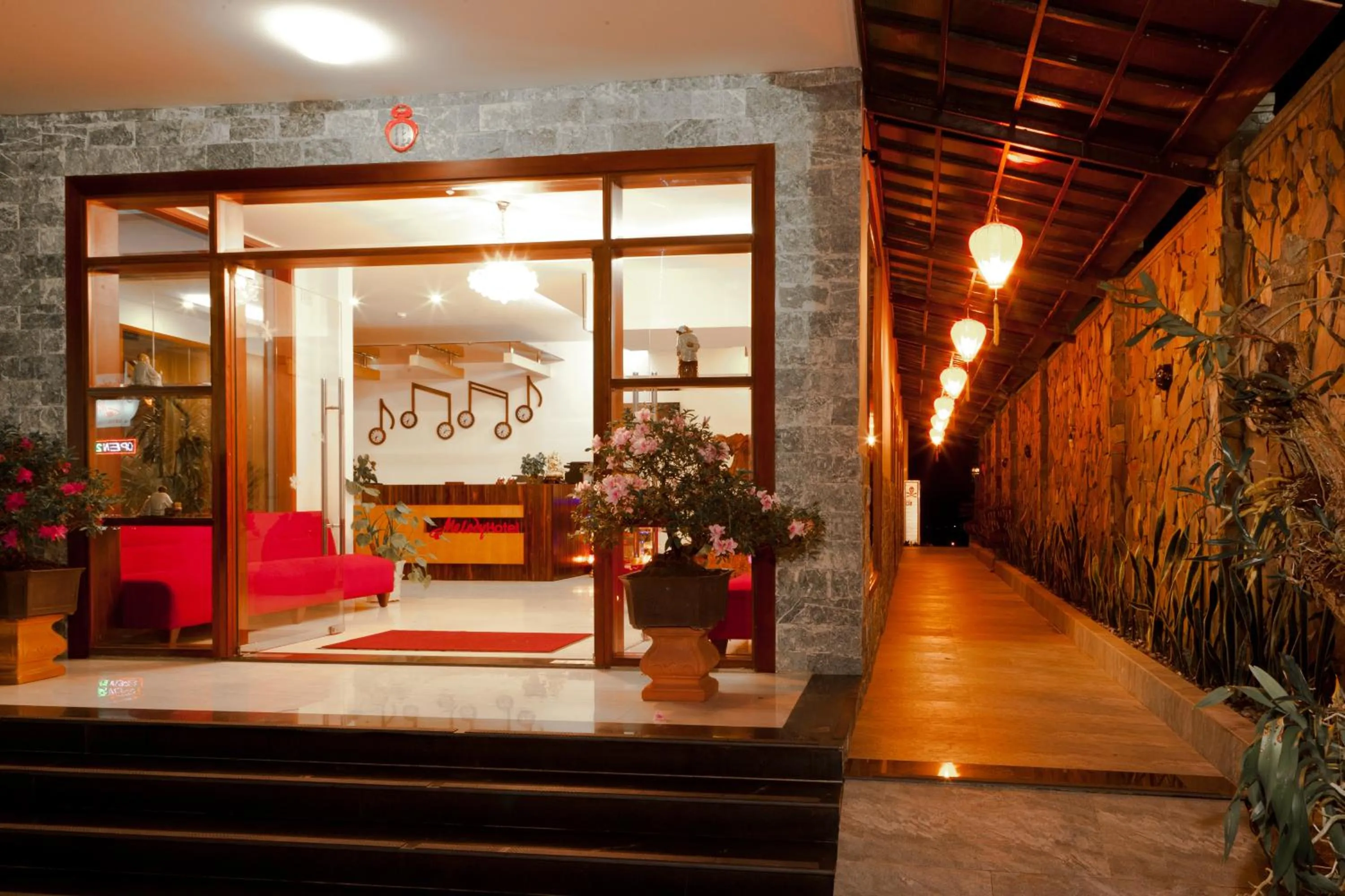 Communal lounge/ TV room in Melody Hotel