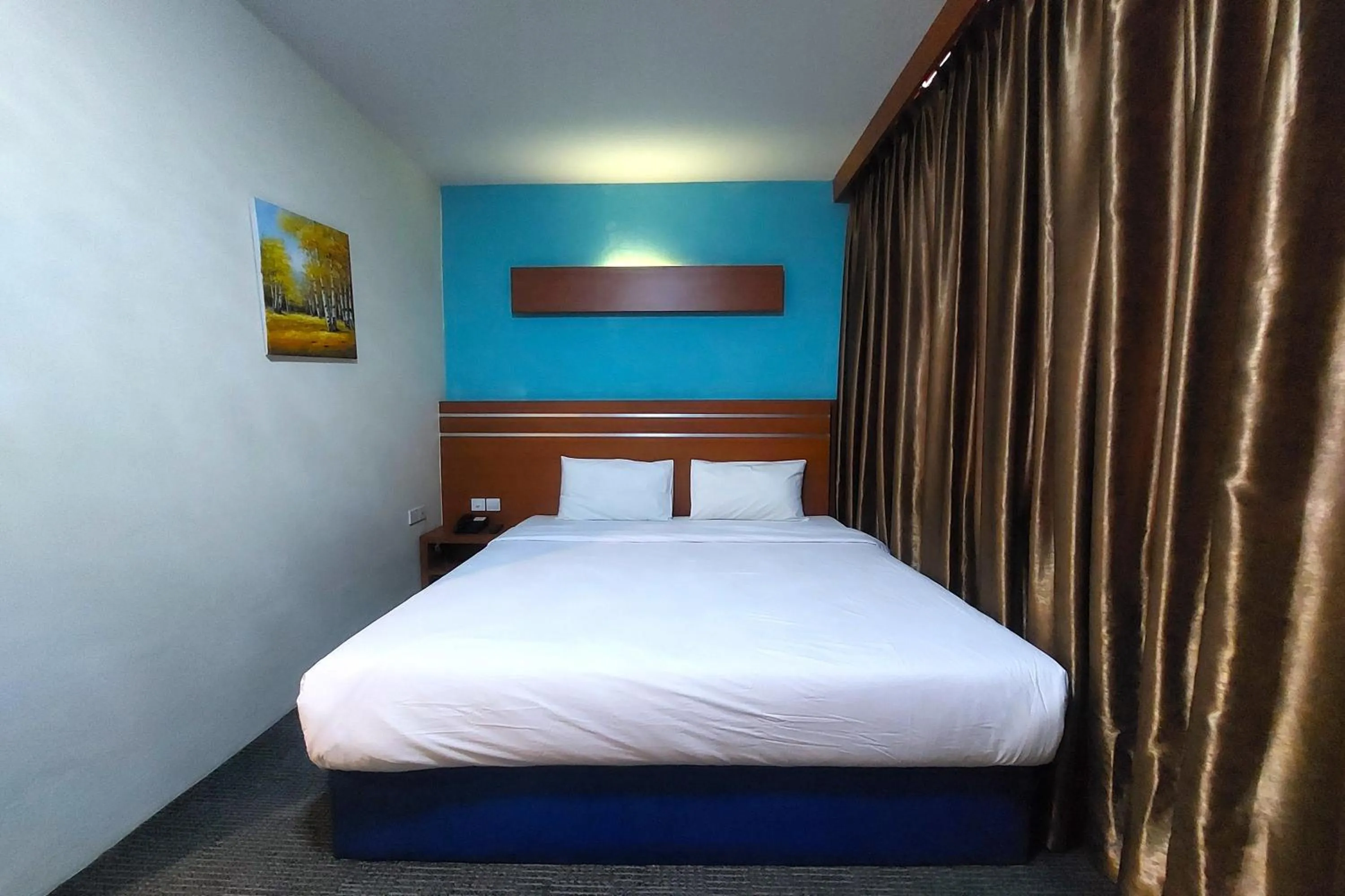 Bed in D'MERLION HOTEL