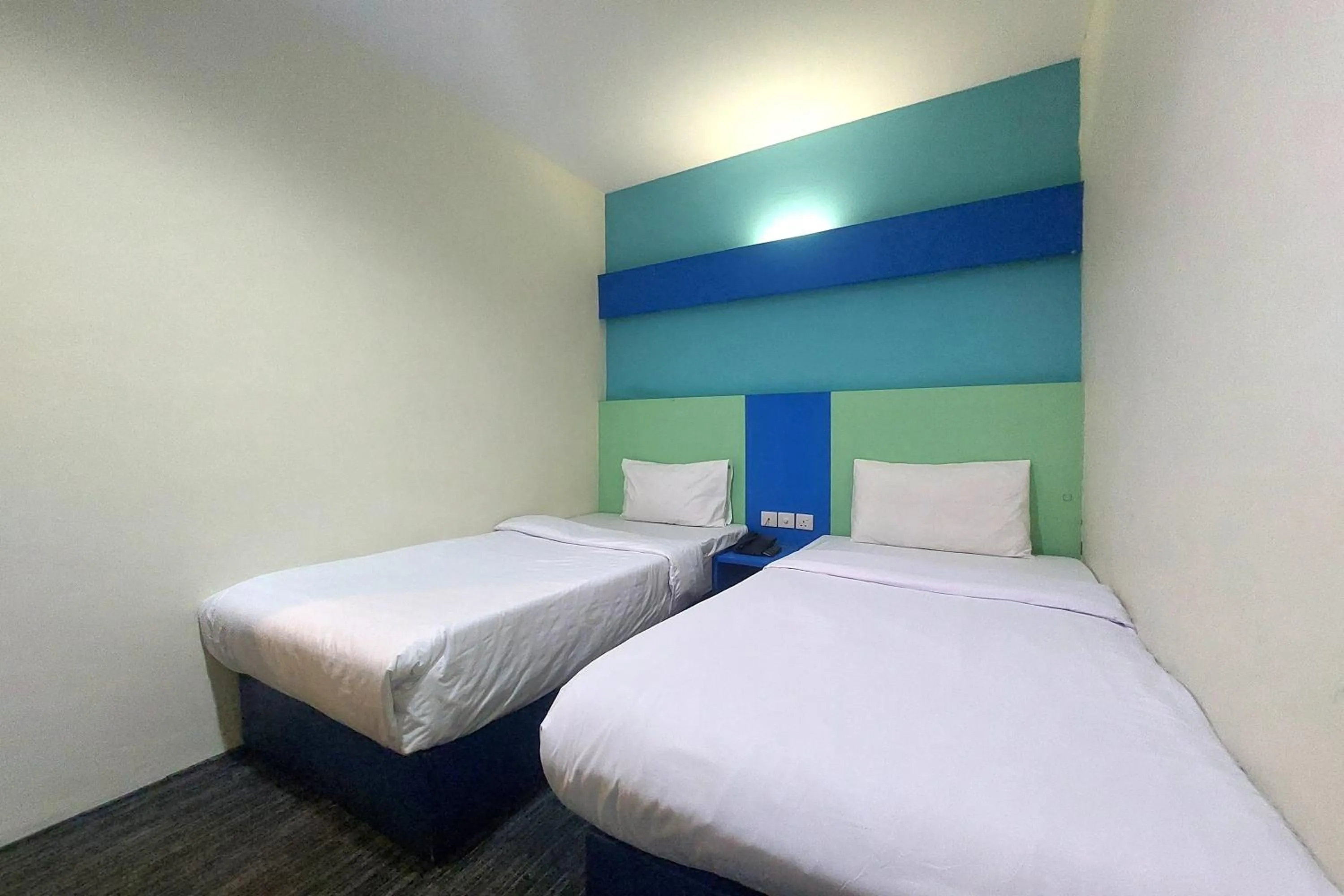 Bedroom in D'MERLION HOTEL