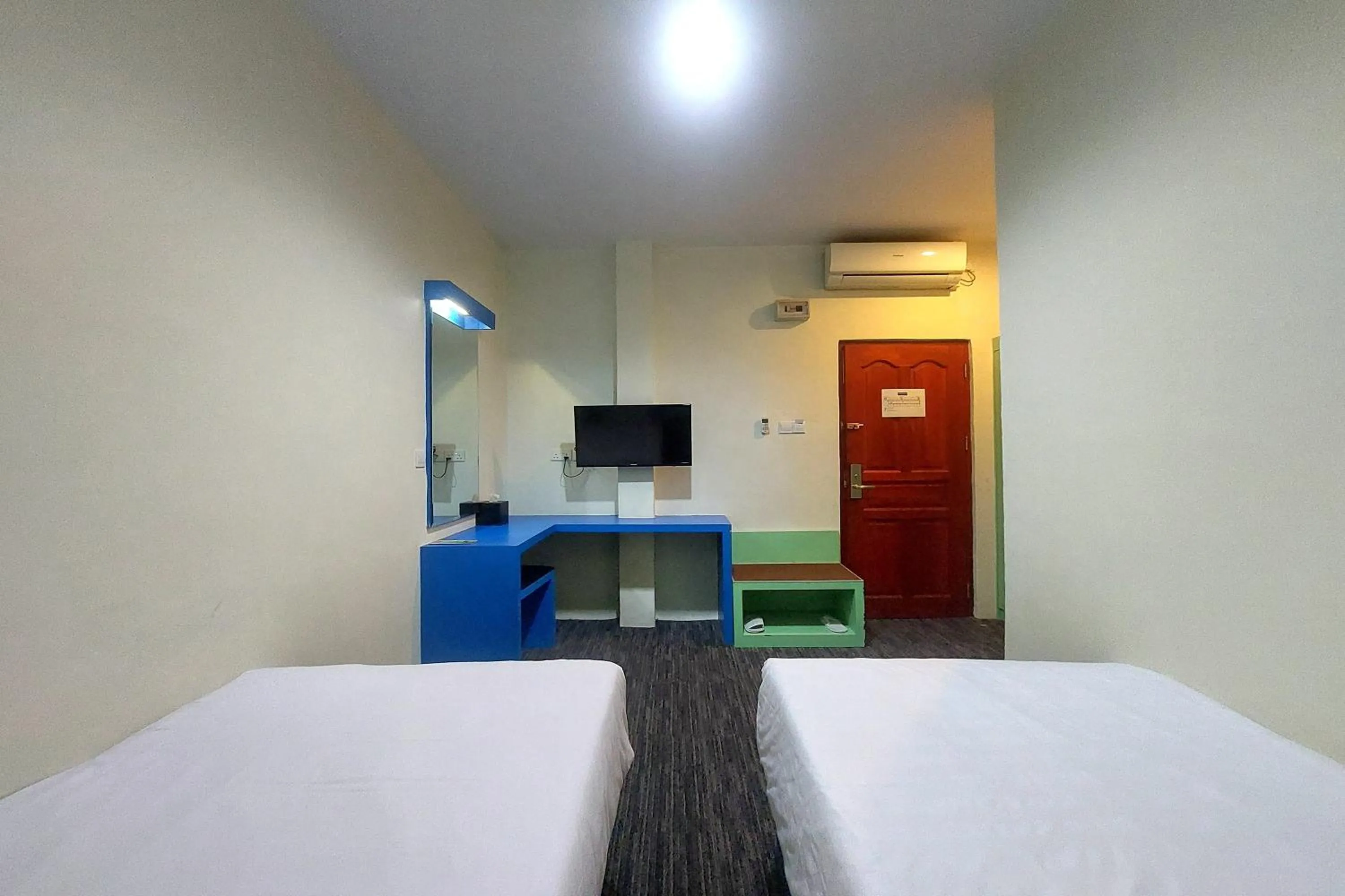 Bed in D'MERLION HOTEL