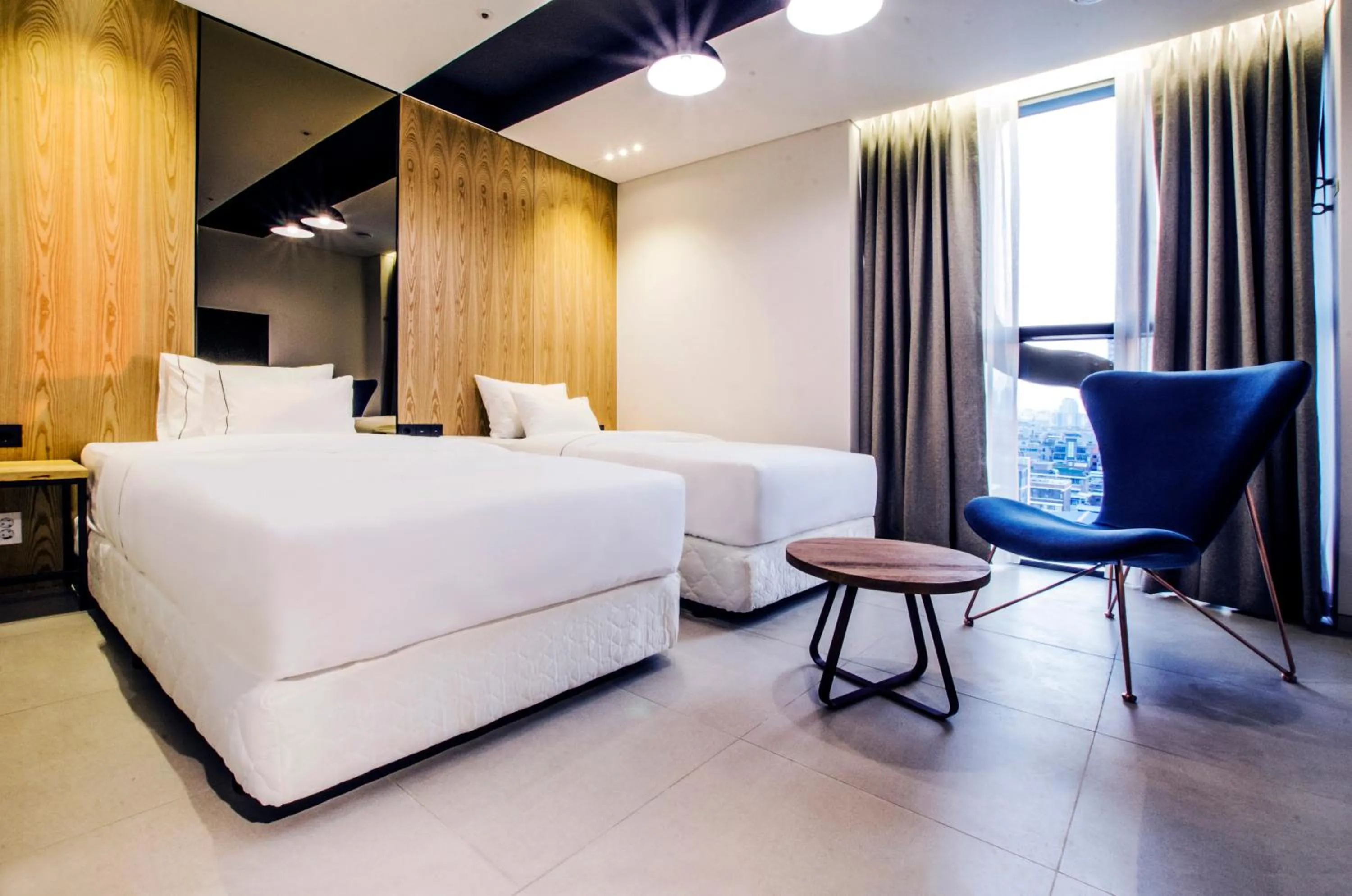 Bed in Hotel The Designers Premier Kondae