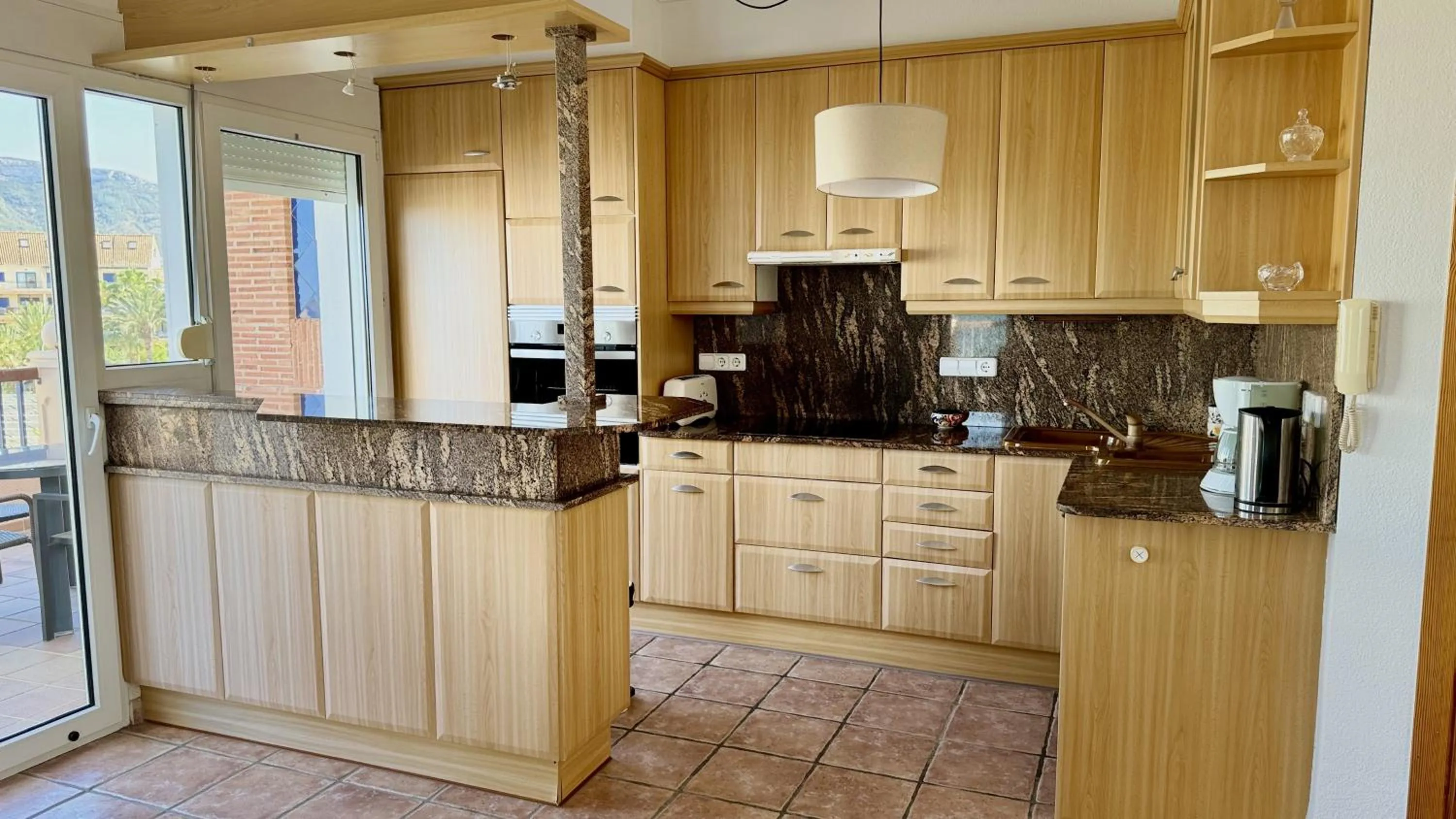 Kitchen or kitchenette in Apartamentos Carlton VyB