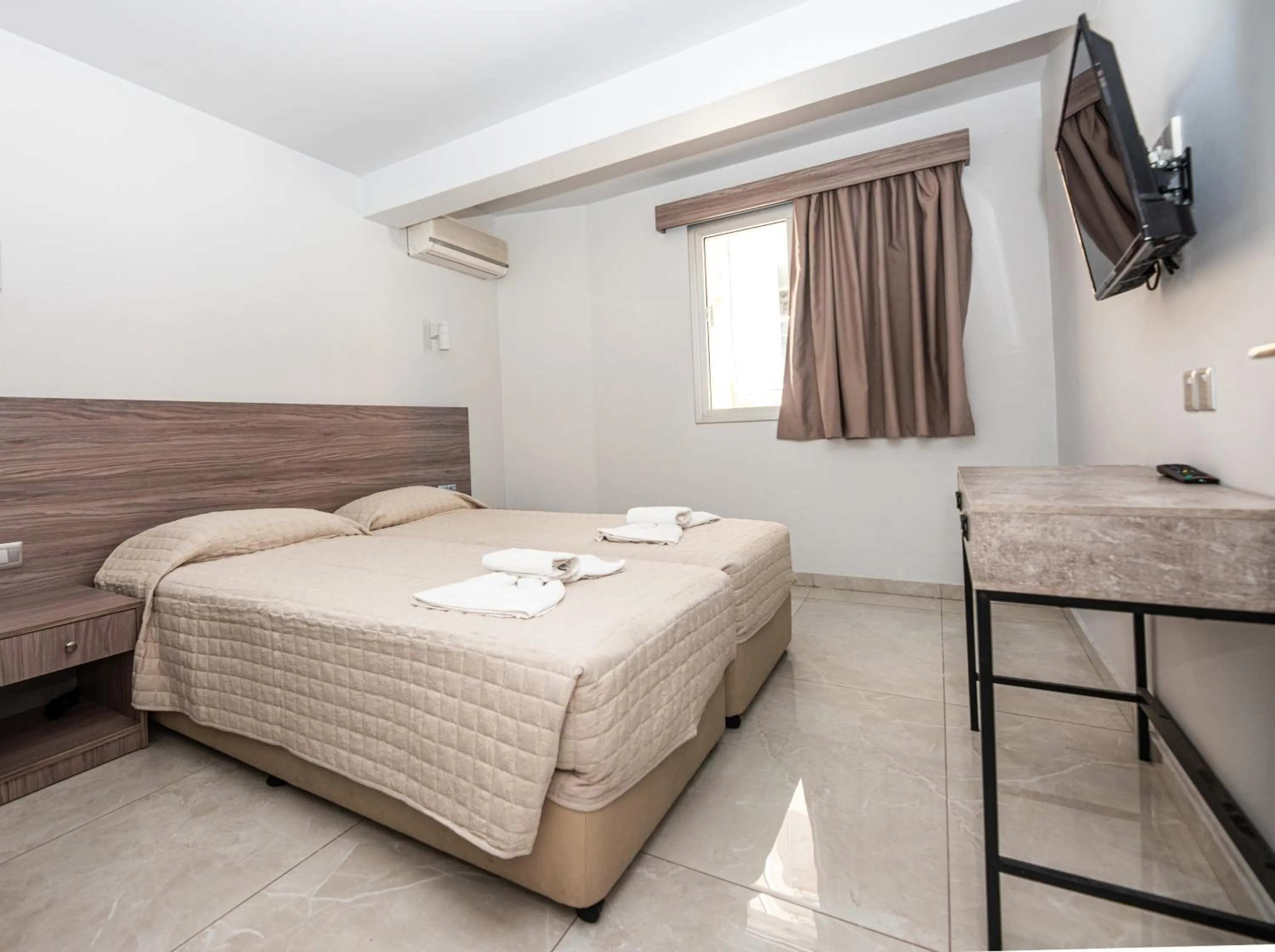 Bed in Paul Marie Hotel Apartments