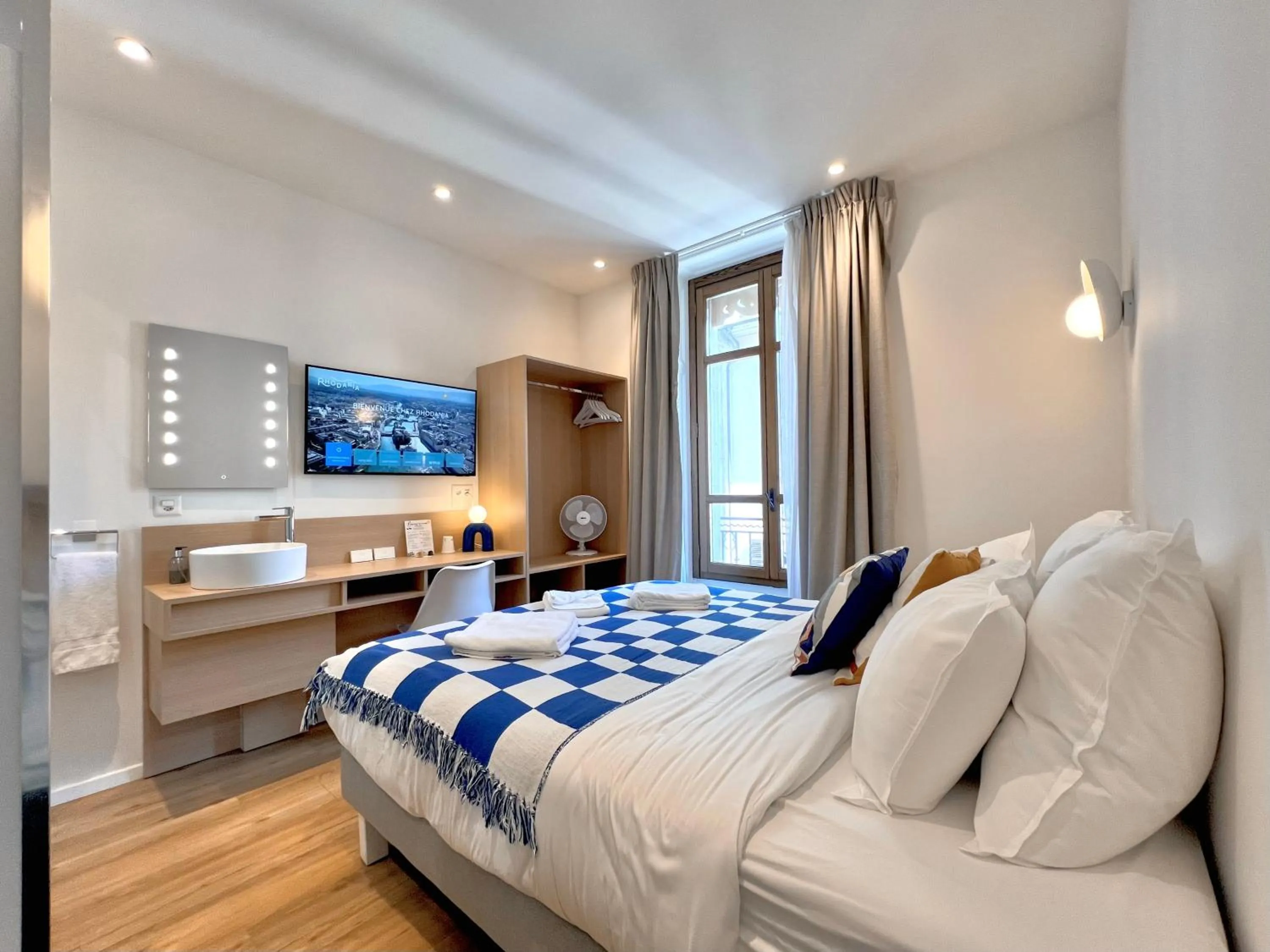 Bed in Rhodania Boutique Hôtel