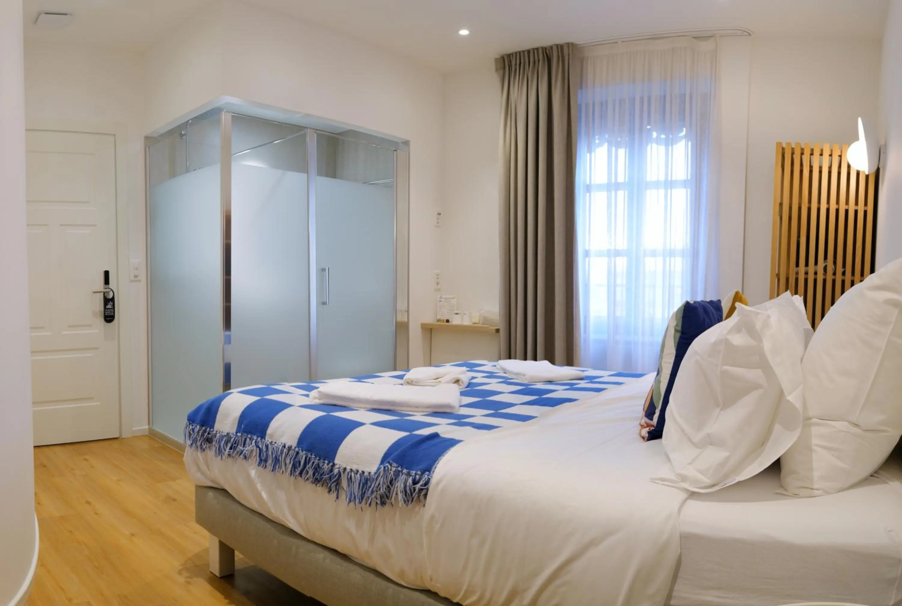 Bed in Rhodania Boutique Hôtel