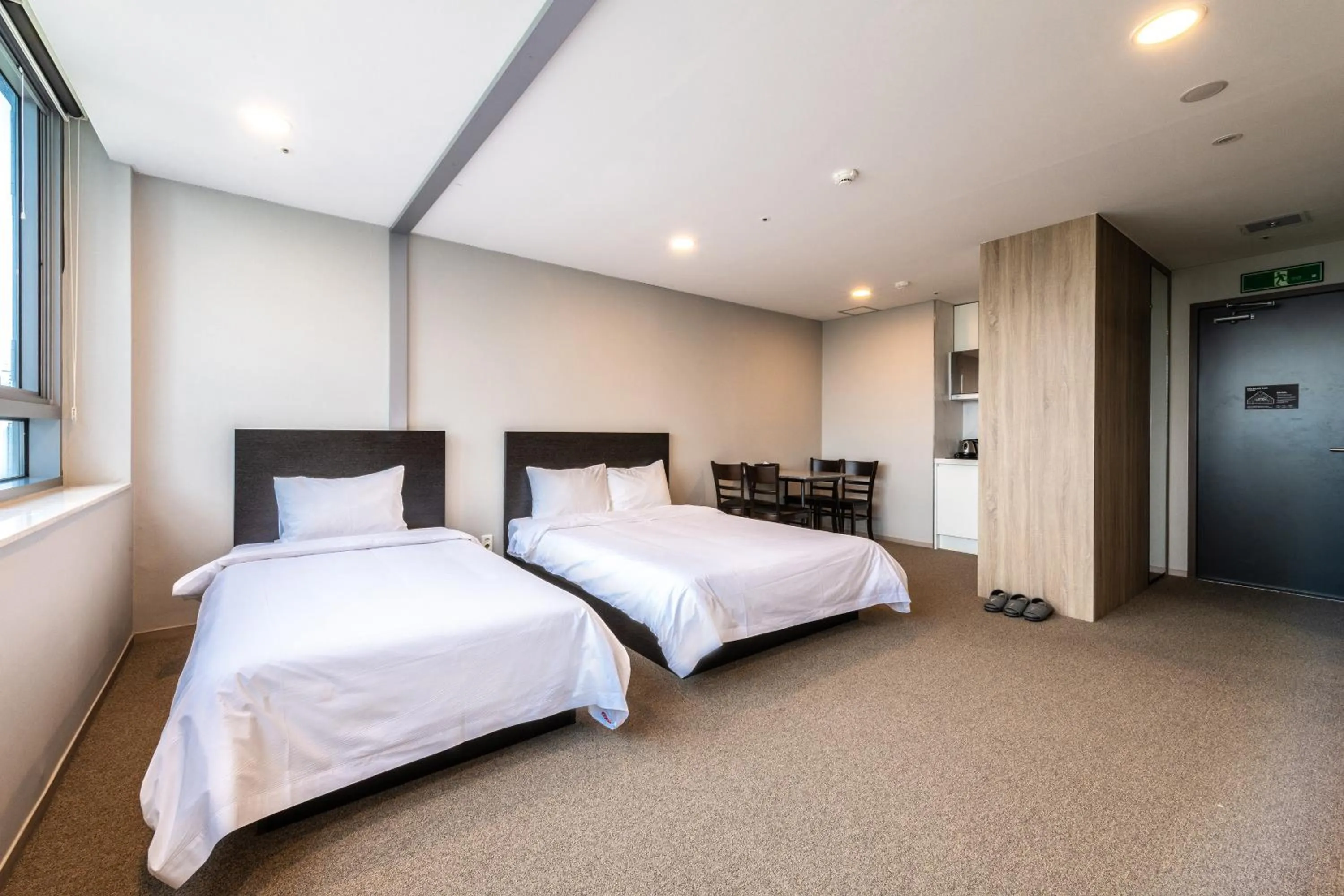 Bed in The Triny Urban Suites