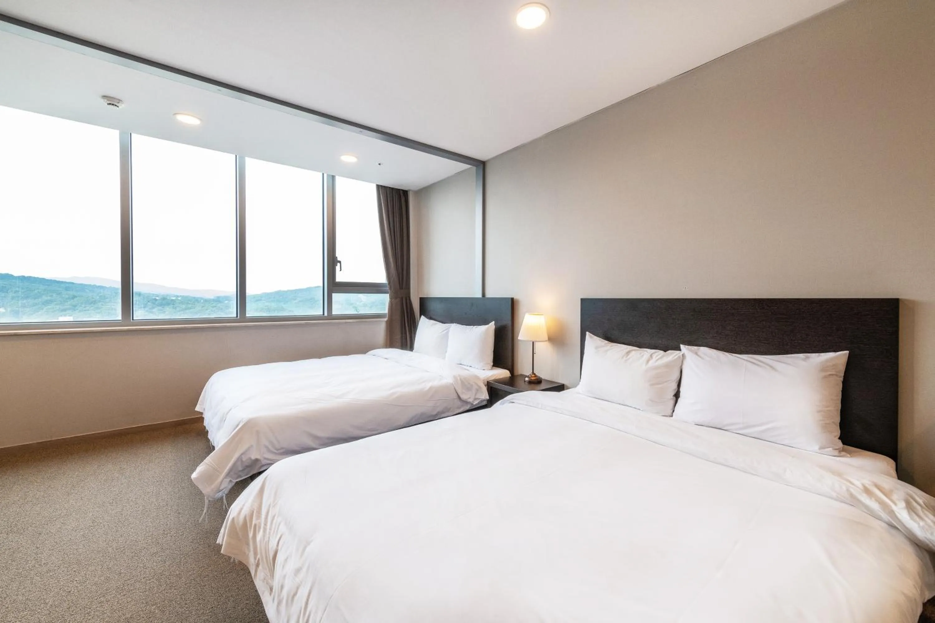 Bed in The Triny Urban Suites