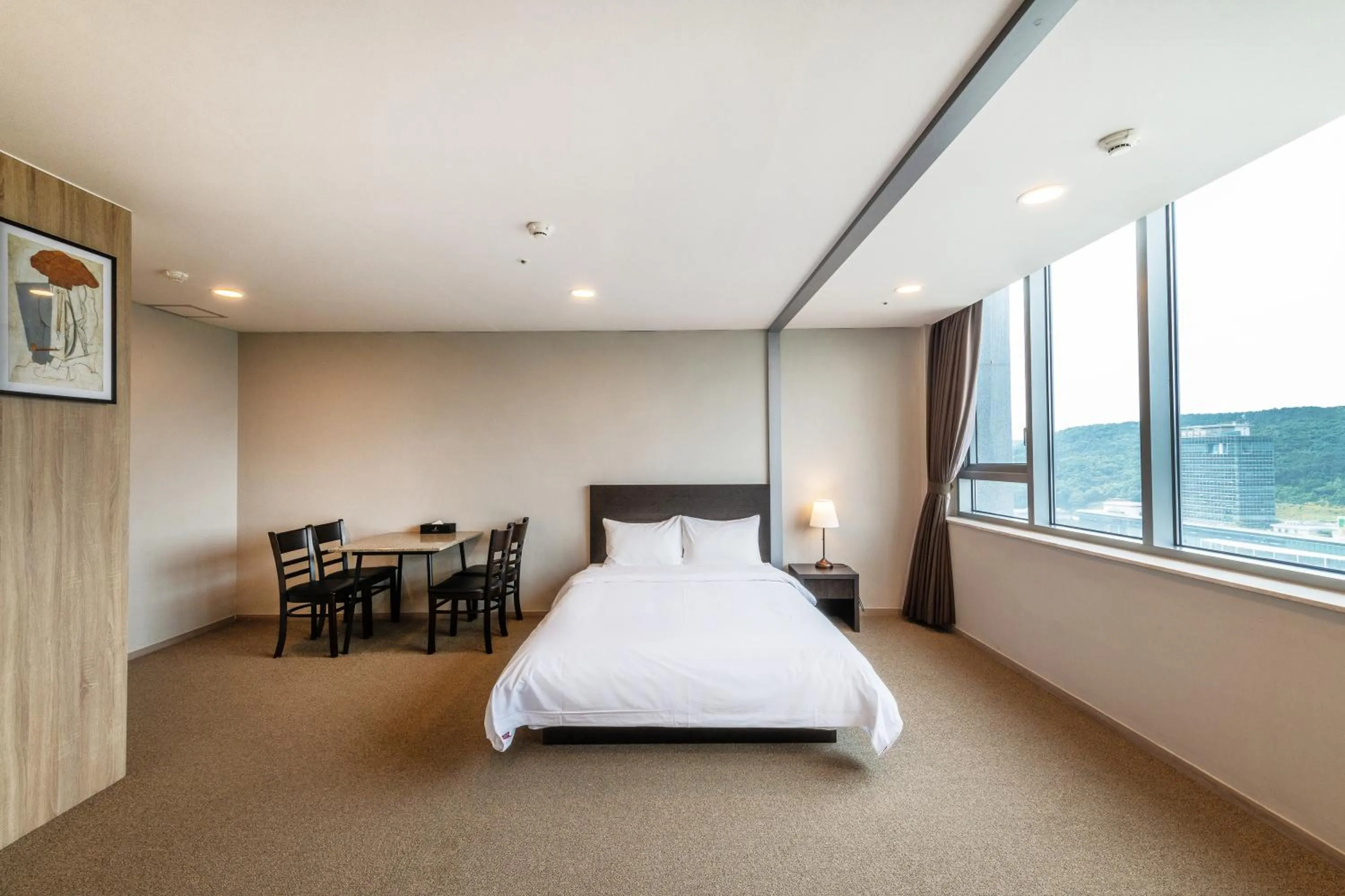 Bed in The Triny Urban Suites