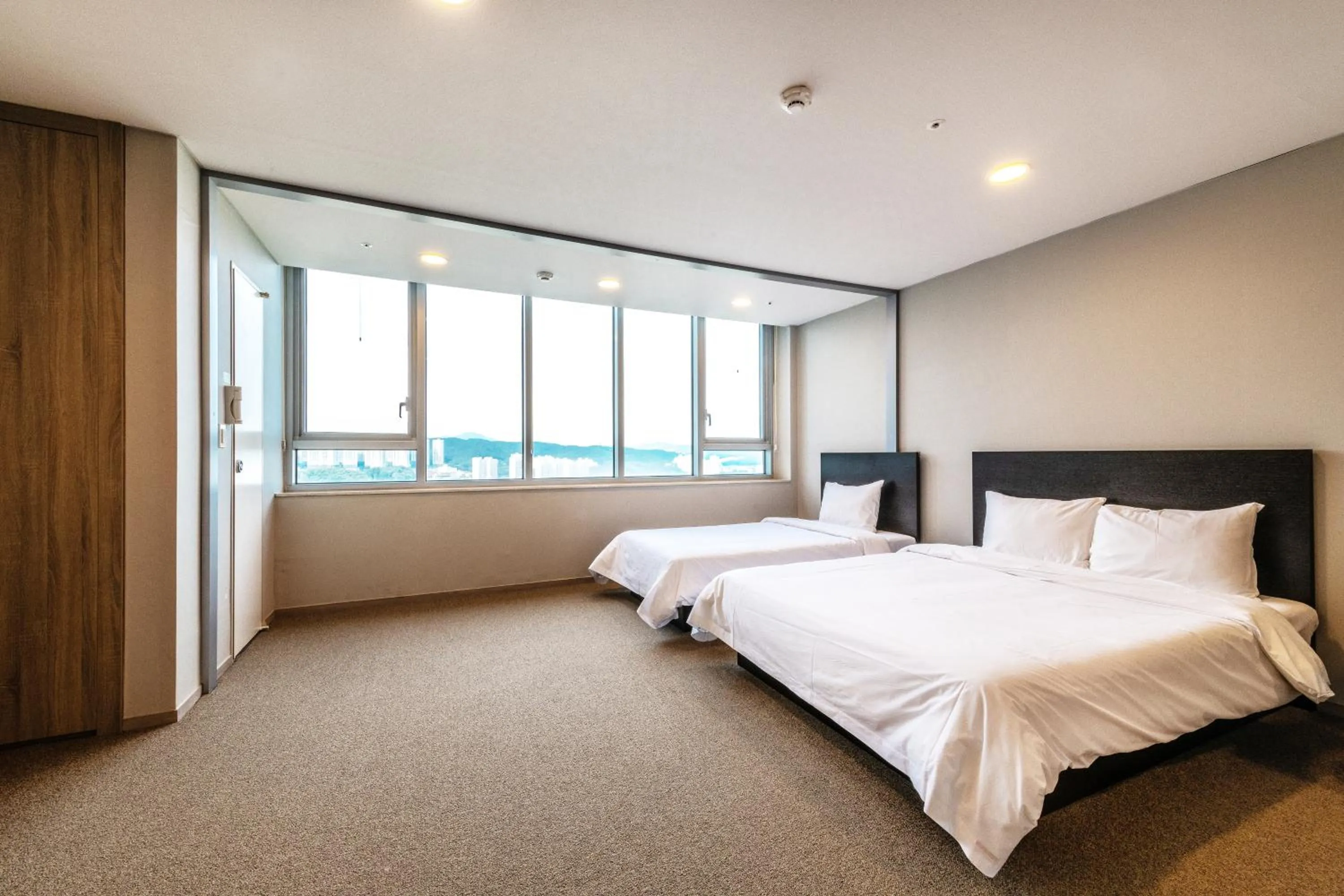 Bed in The Triny Urban Suites