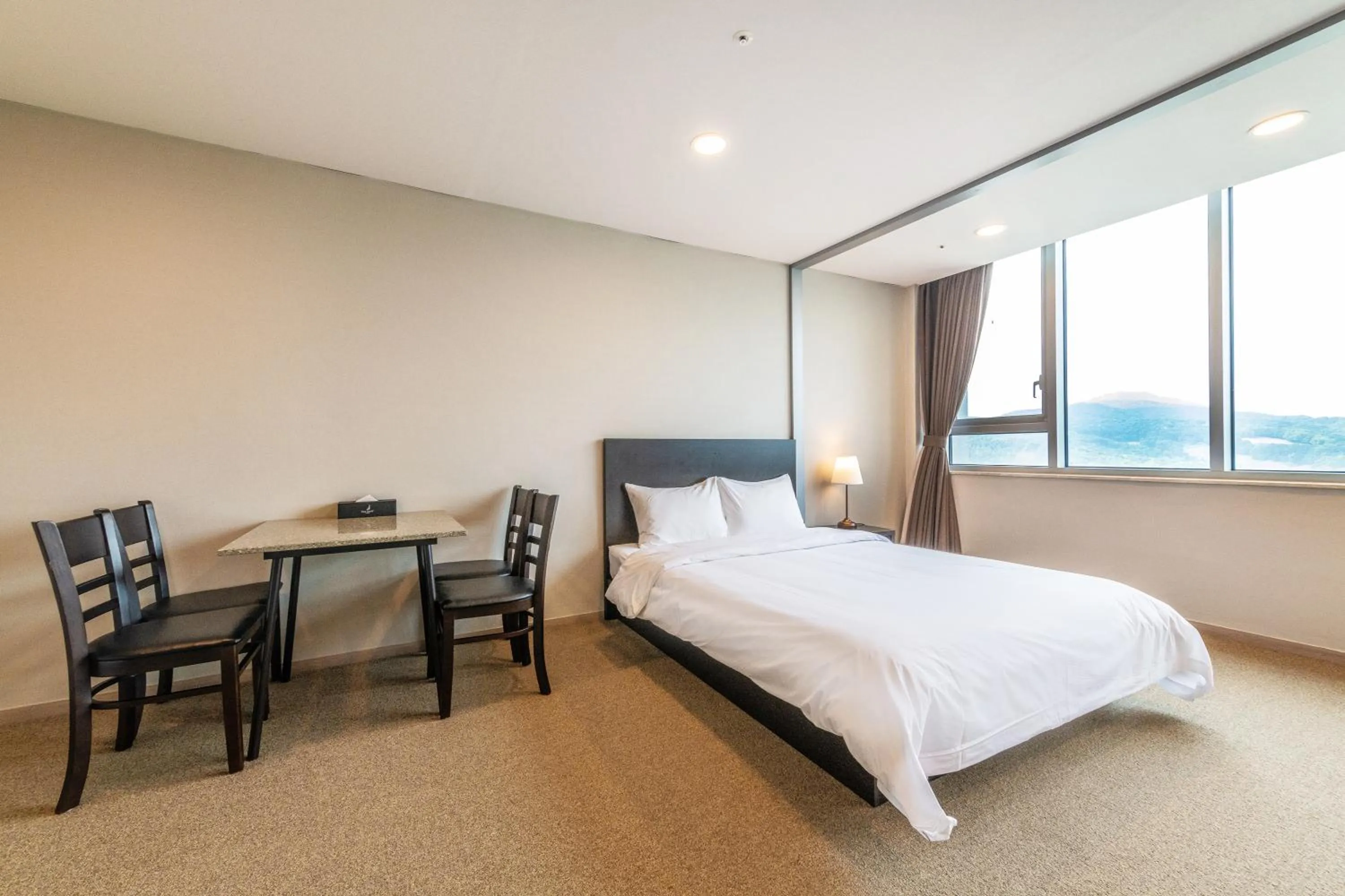 Bed in The Triny Urban Suites